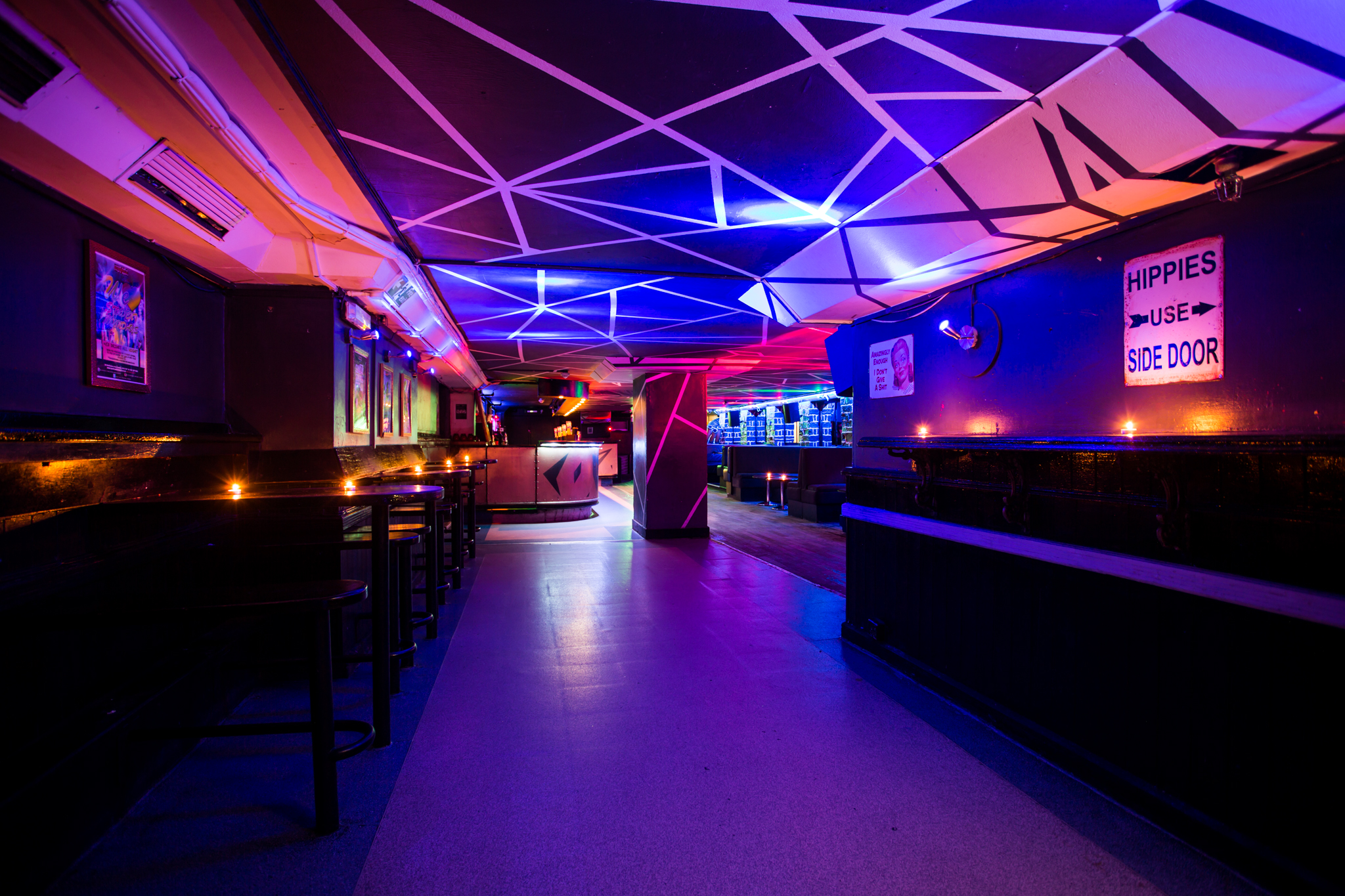 Vibrant event space at Bar Rumba with dynamic lighting for lively gatherings and parties.