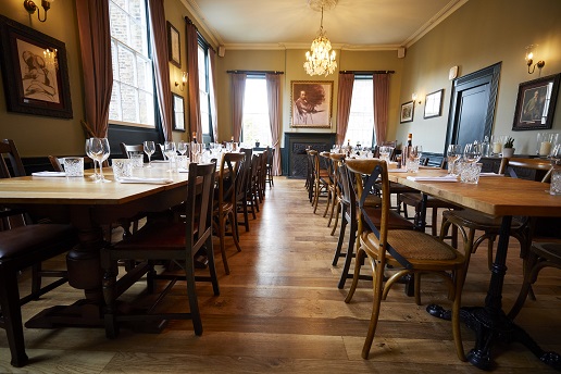 Romney Room dining space with elegant decor for intimate gatherings and corporate events.