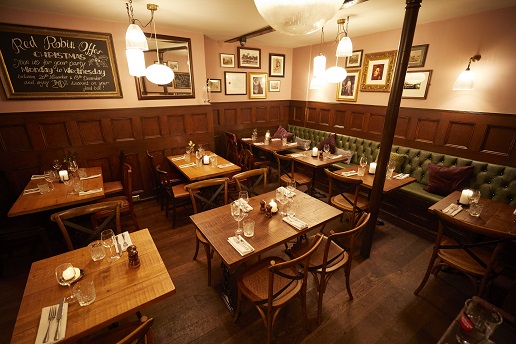 Cozy dining space in The Holly Bush, perfect for intimate gatherings and corporate events.
