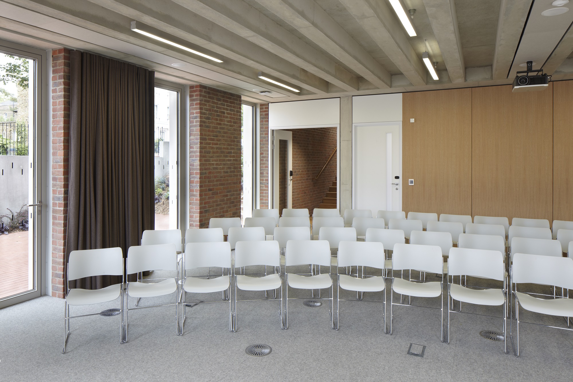 Versatile meeting space with natural light at ORTUS Conference Venue for workshops and events.