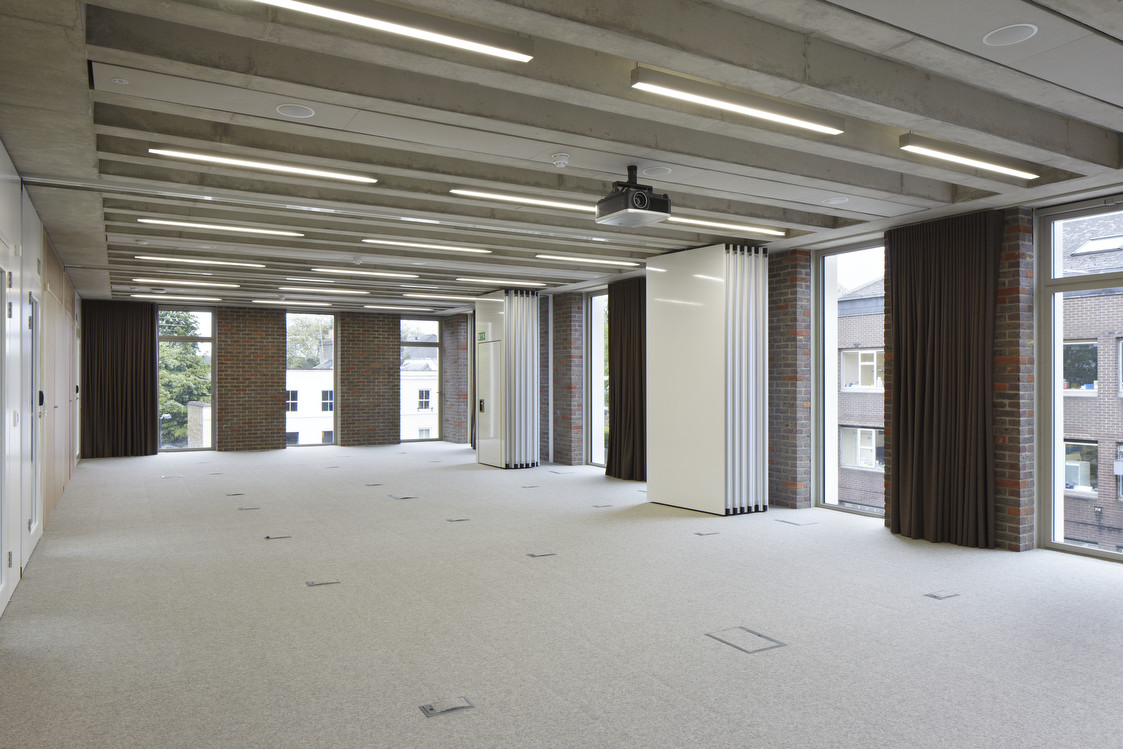 Versatile meeting space with natural light for corporate events and workshops.