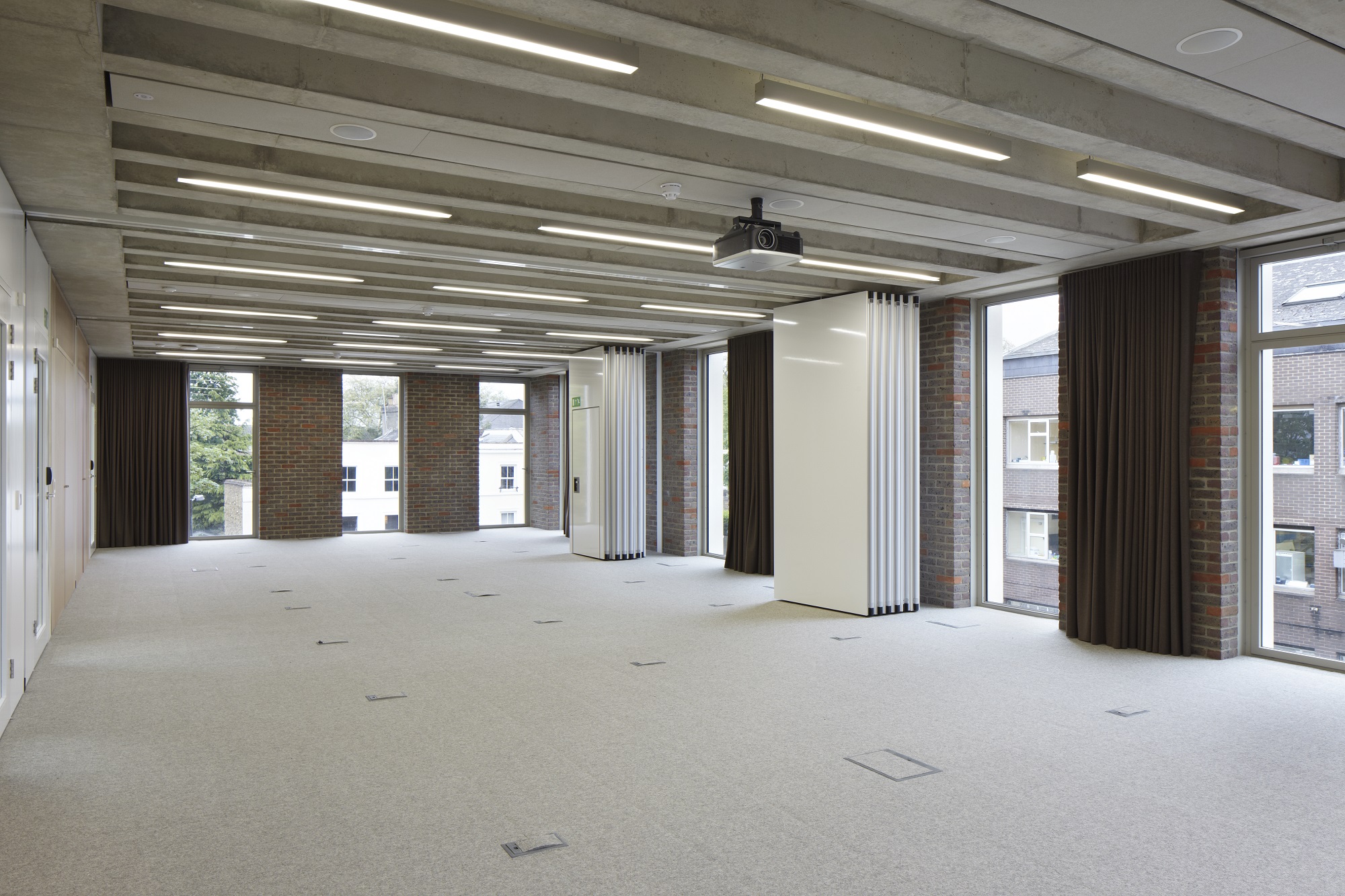 Versatile meeting space with natural light for corporate events and workshops at ORTUS Venue.