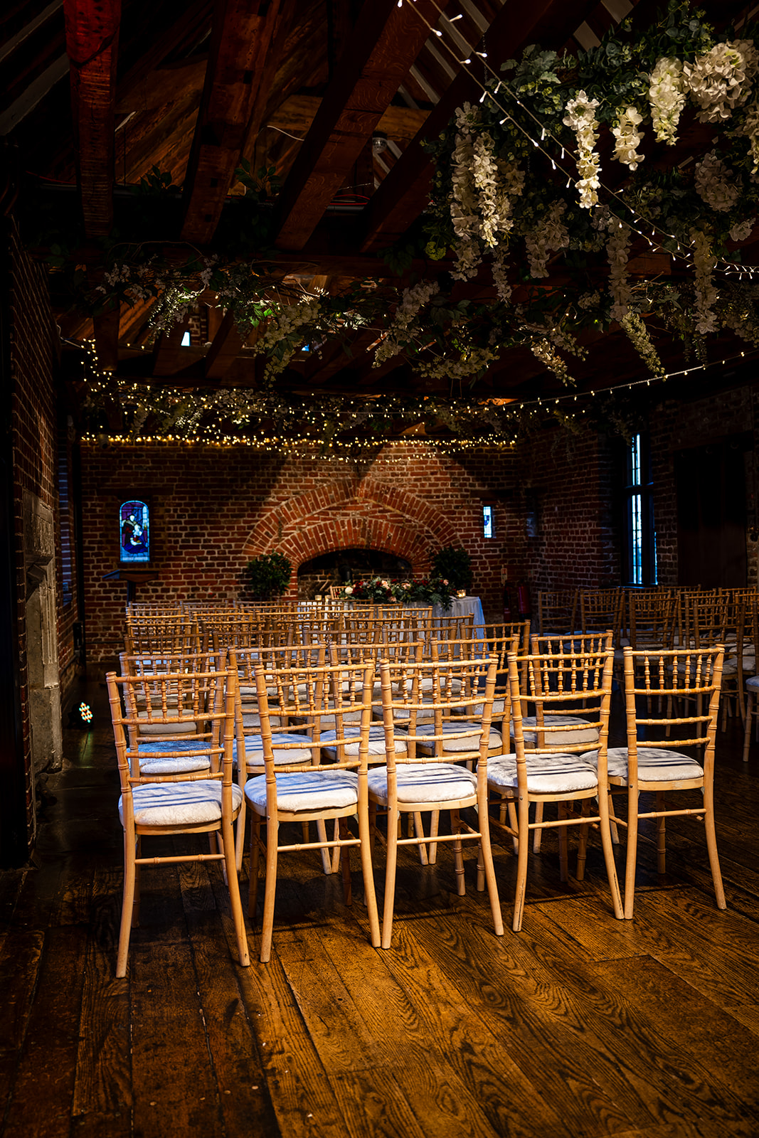 Tudor Barn Eltham event space with cozy brick walls, ideal for weddings and gatherings.