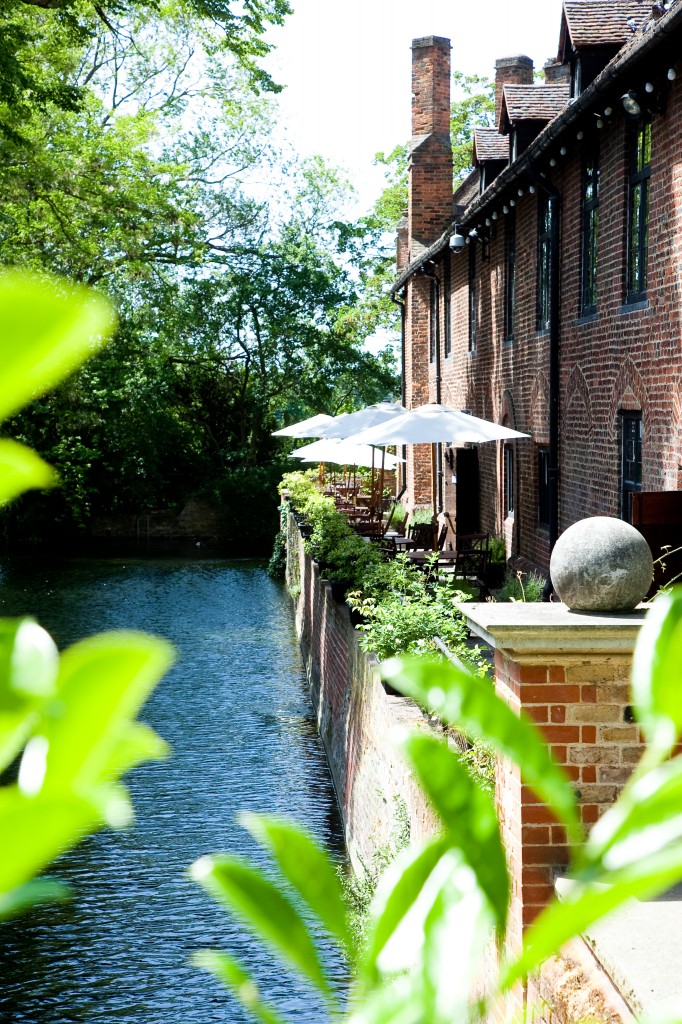 Outdoor bar and restaurant at Tudor Barn Eltham, ideal for events with lush greenery.