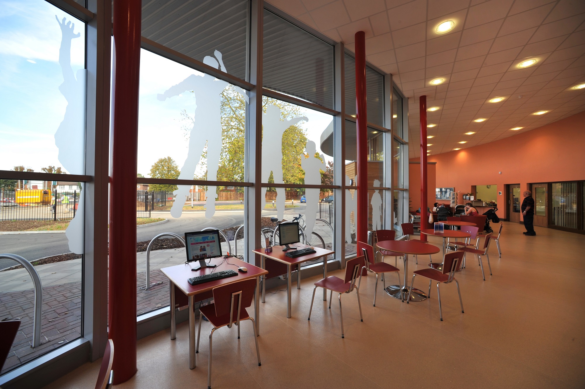 Modern event space with large windows, ideal for workshops and networking.
