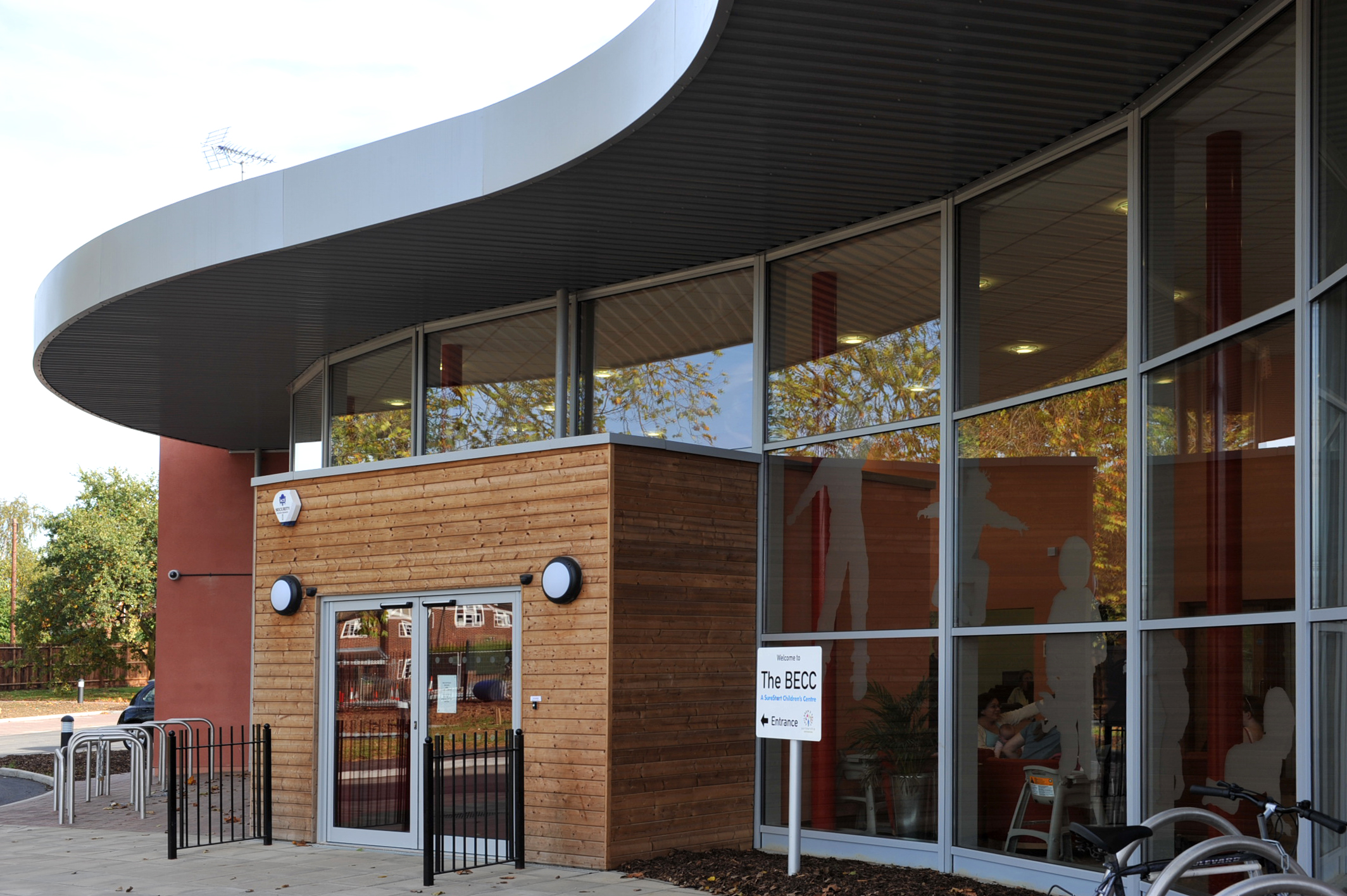 Modern reception venue with curved design and large windows for events and meetings.