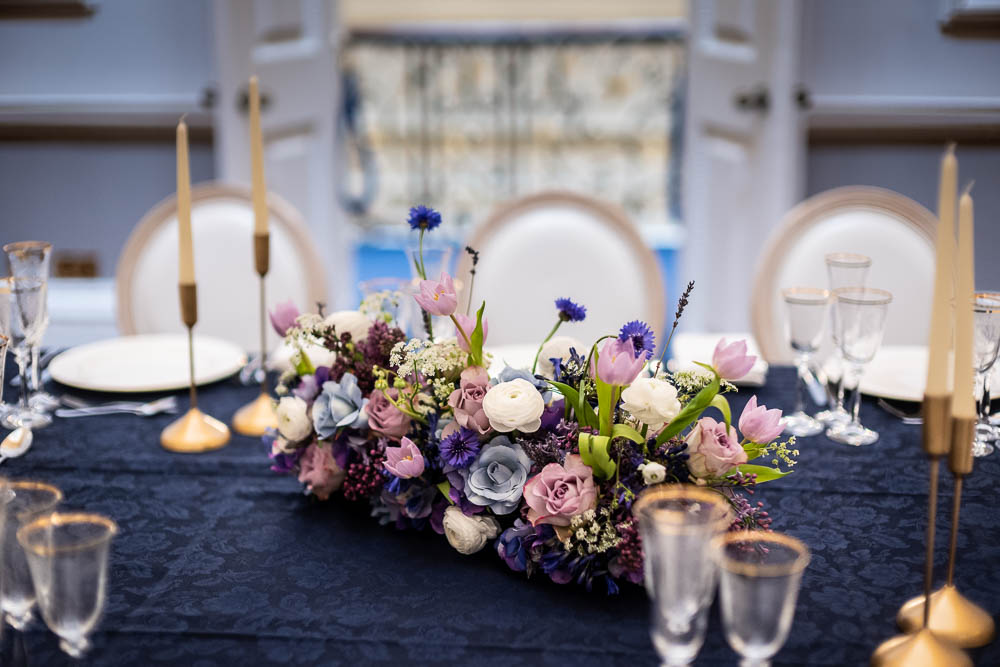 Elegant table setting with floral centerpiece for upscale events at Wrench Room, Six Park Place.
