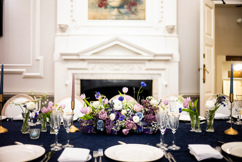 Elegant dining table with floral centerpiece for sophisticated events at Wrench Room.