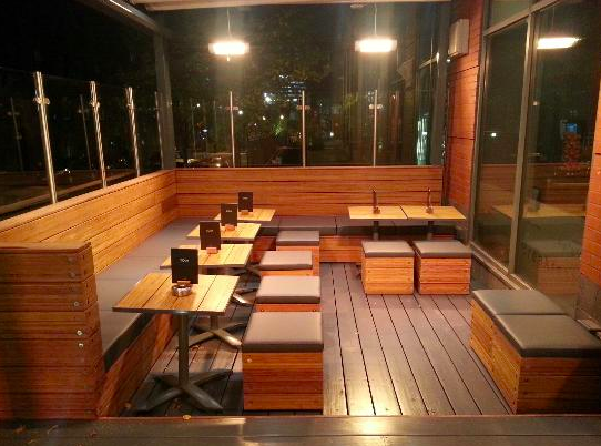 Stylish outdoor seating at Zouk Tea Bar & Grill, perfect for networking events.