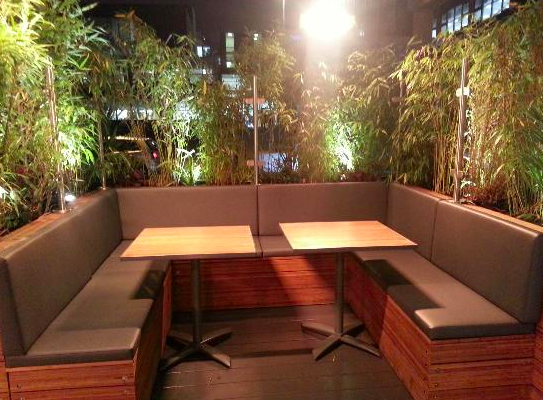 Cozy semi-private seating area at Zouk Tea Bar & Grill for networking events.