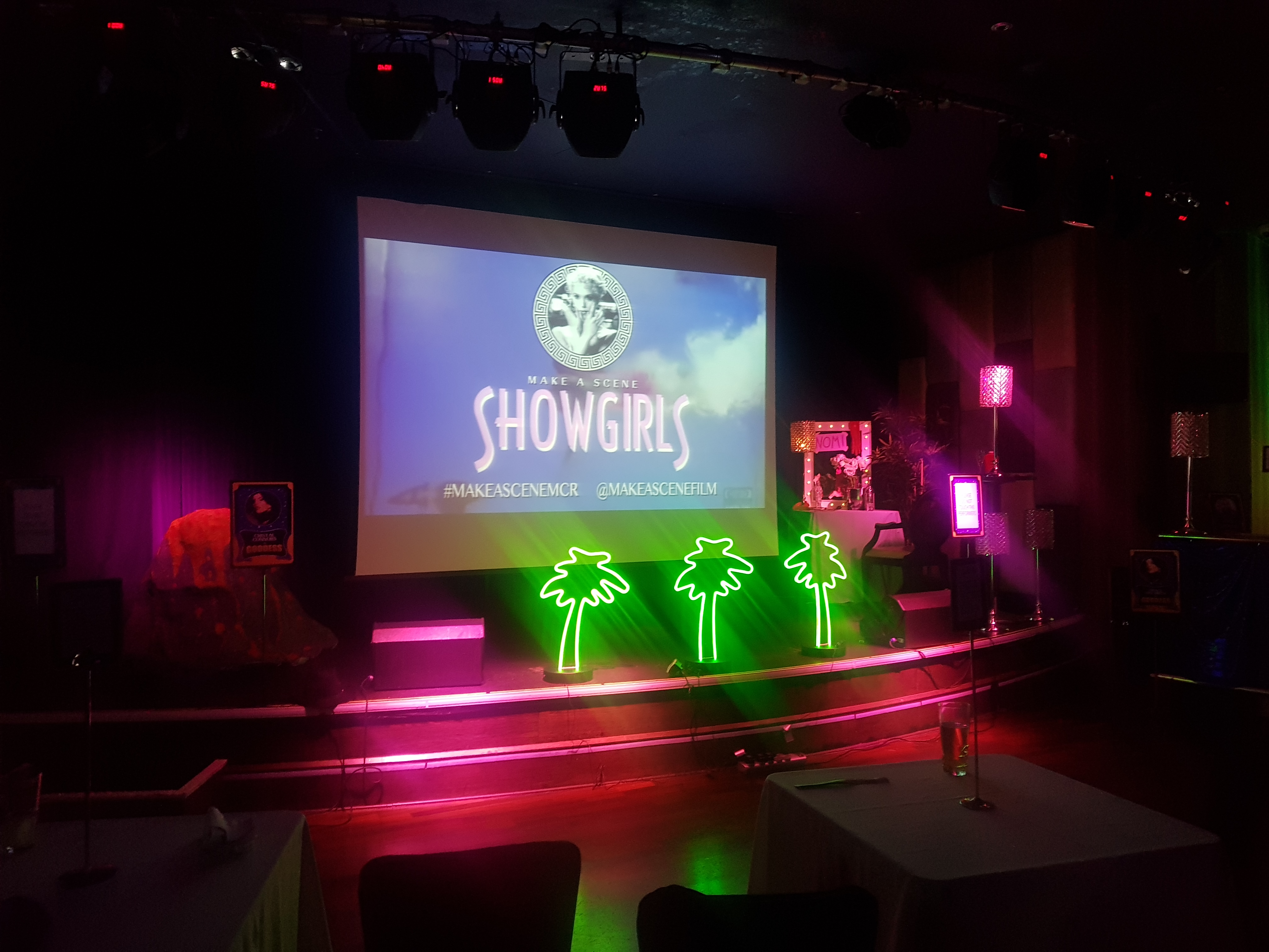 Private Events Suite in Manchester 235 with vibrant "SHOWGIRLS" stage setup for entertainment.