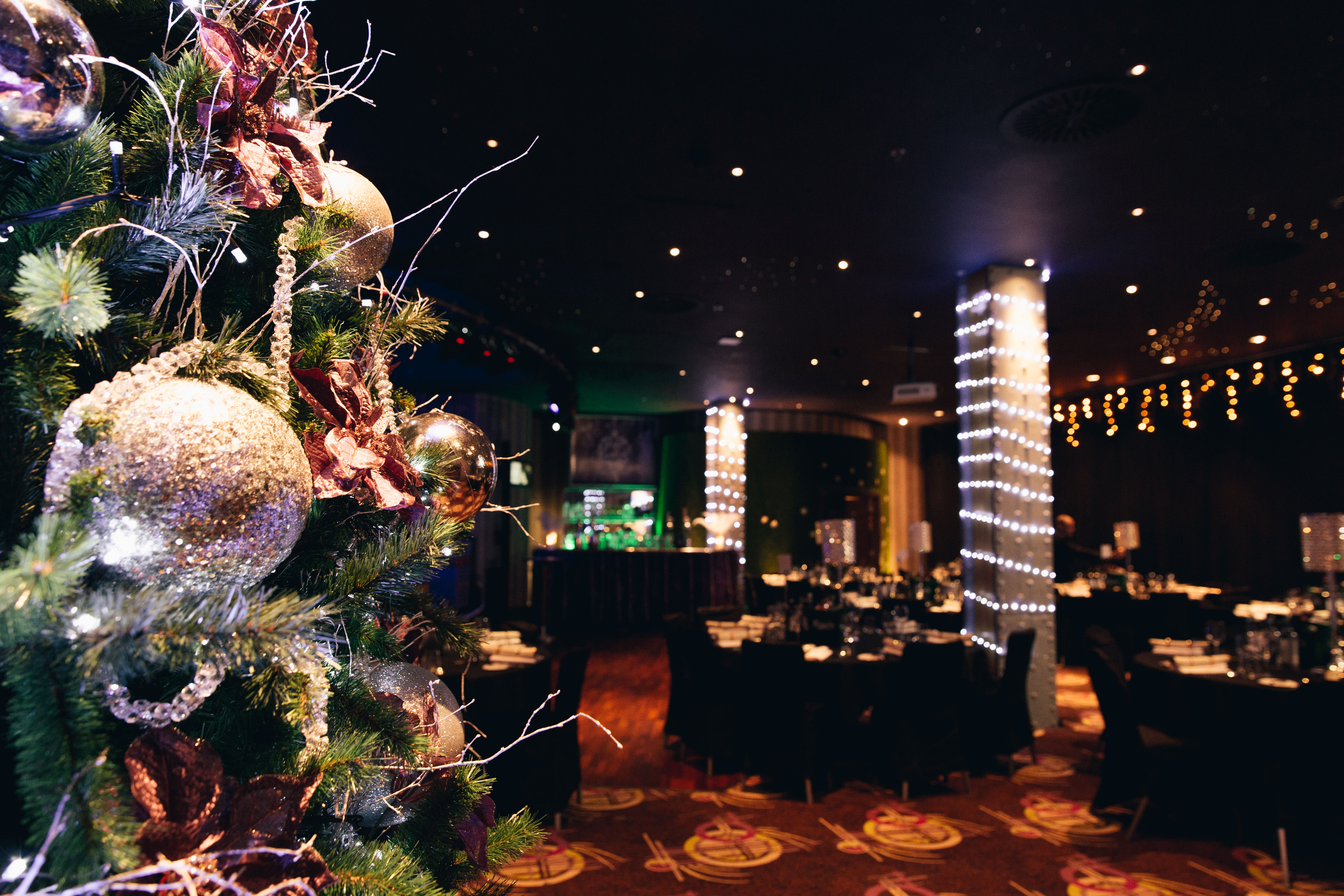 "Private Events Suite in Manchester 235 with festive tree, ideal for corporate gatherings."