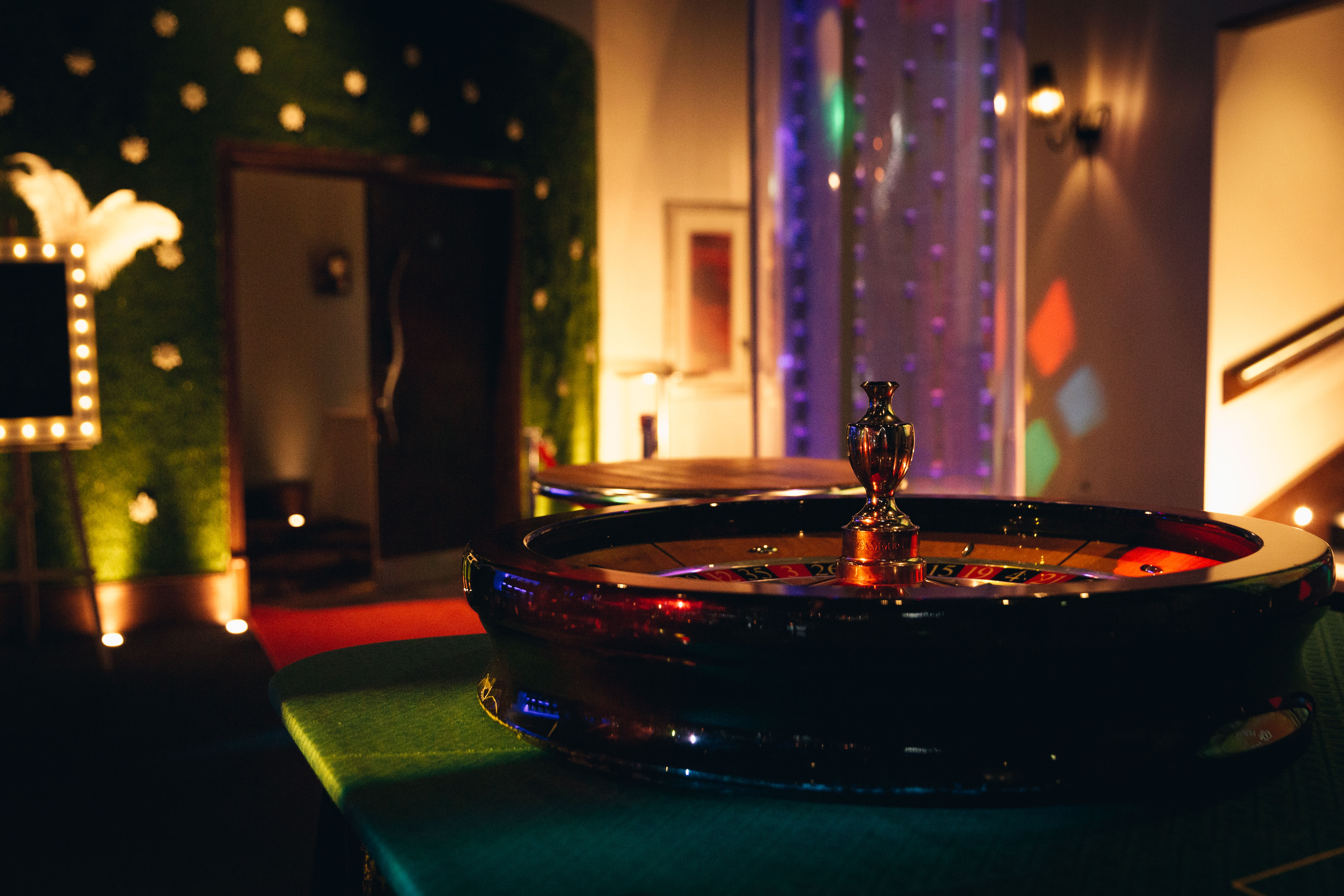 Vibrant casino-themed event space with roulette table at Manchester 235.