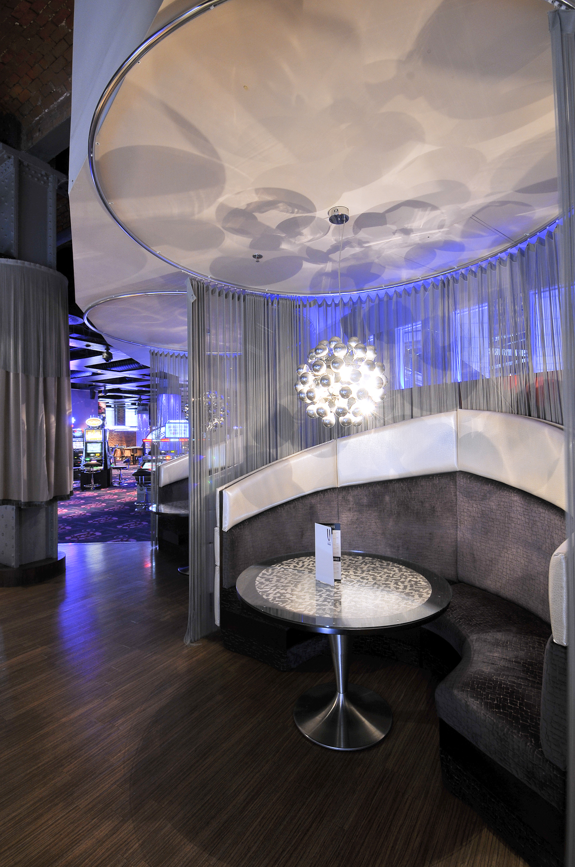 Vega Lounge Manchester: modern decor, elegant chandelier for networking events.