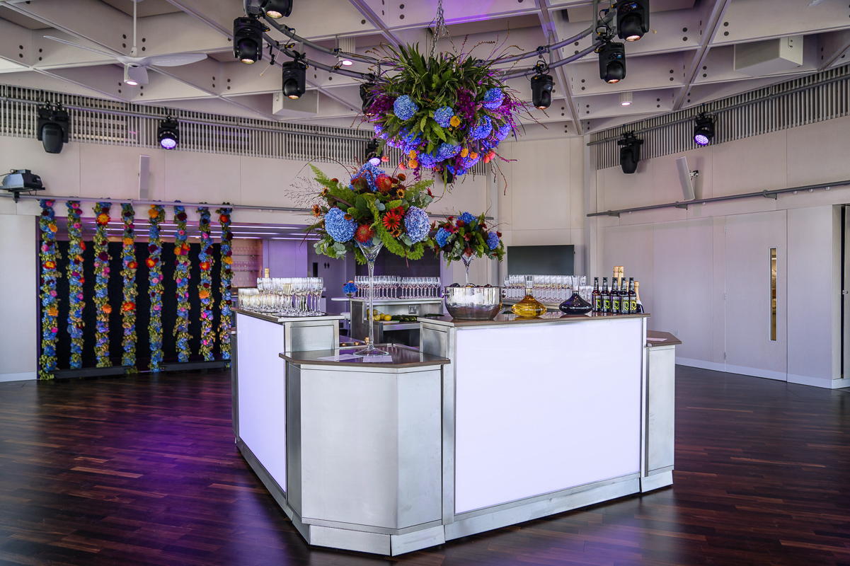 Stylish Buffini Chao Deck with modern bar and floral decor for events and gatherings.