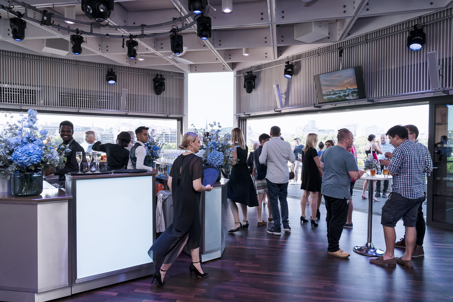Buffini Chao Deck event space with sleek bar, ideal for networking and meetings.