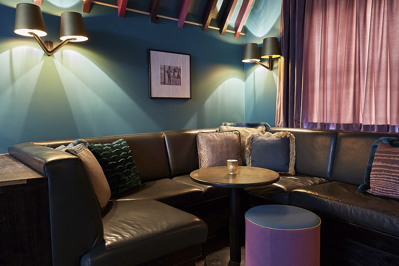 Cozy lounge at Penthouse Champagne Bar, ideal for networking events and meetings.