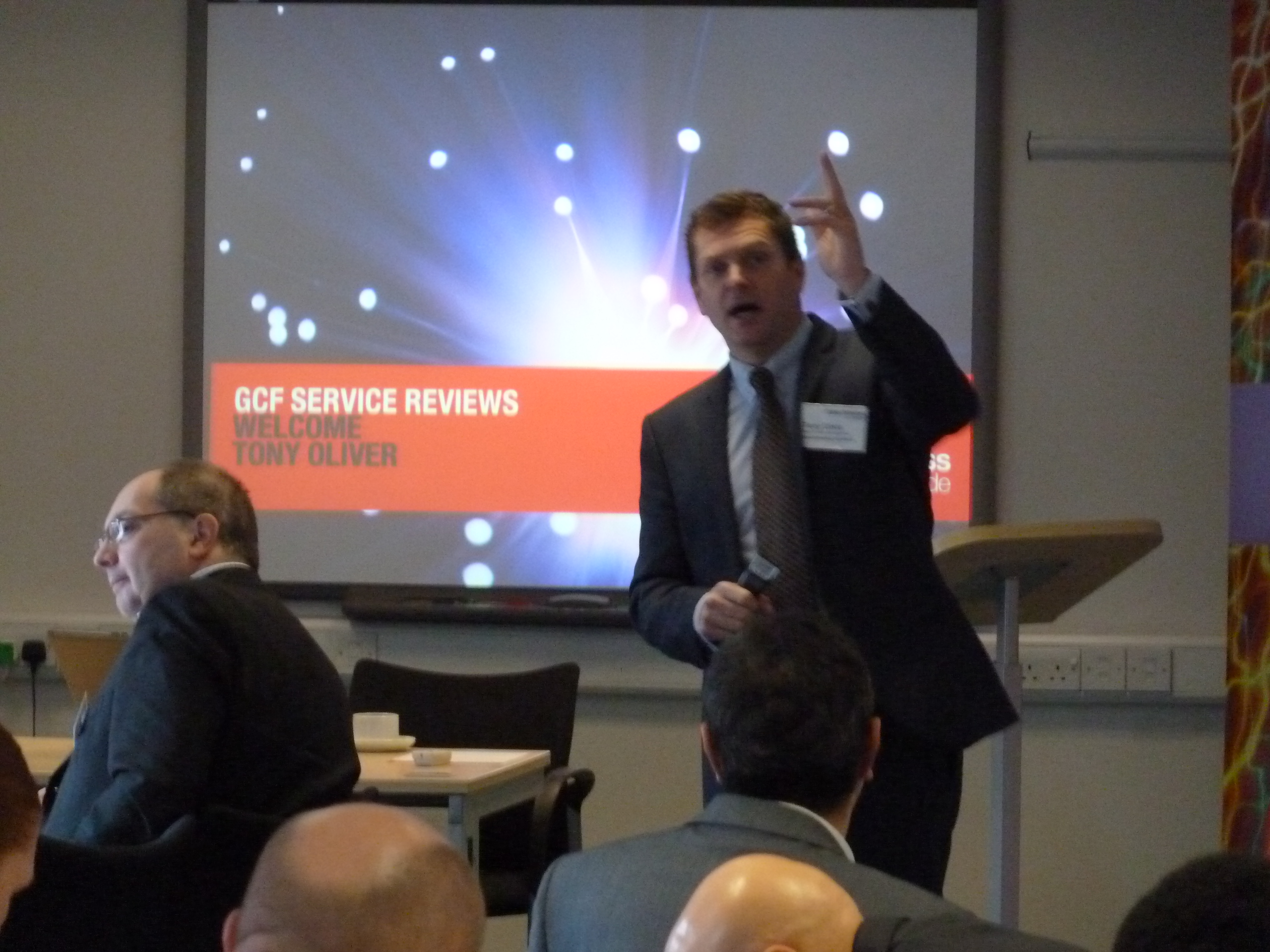 Conference Suite in Liverpool with speaker engaging audience during a presentation event.