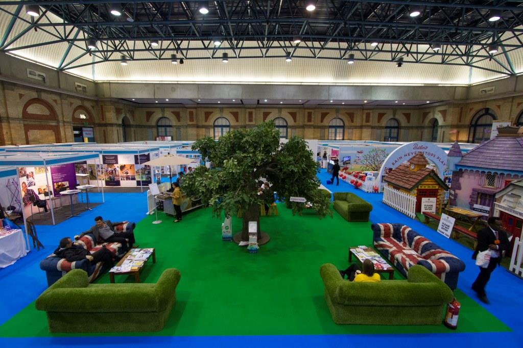 West Hall at Alexandra Palace: vibrant exhibition space with green area for events and networking.