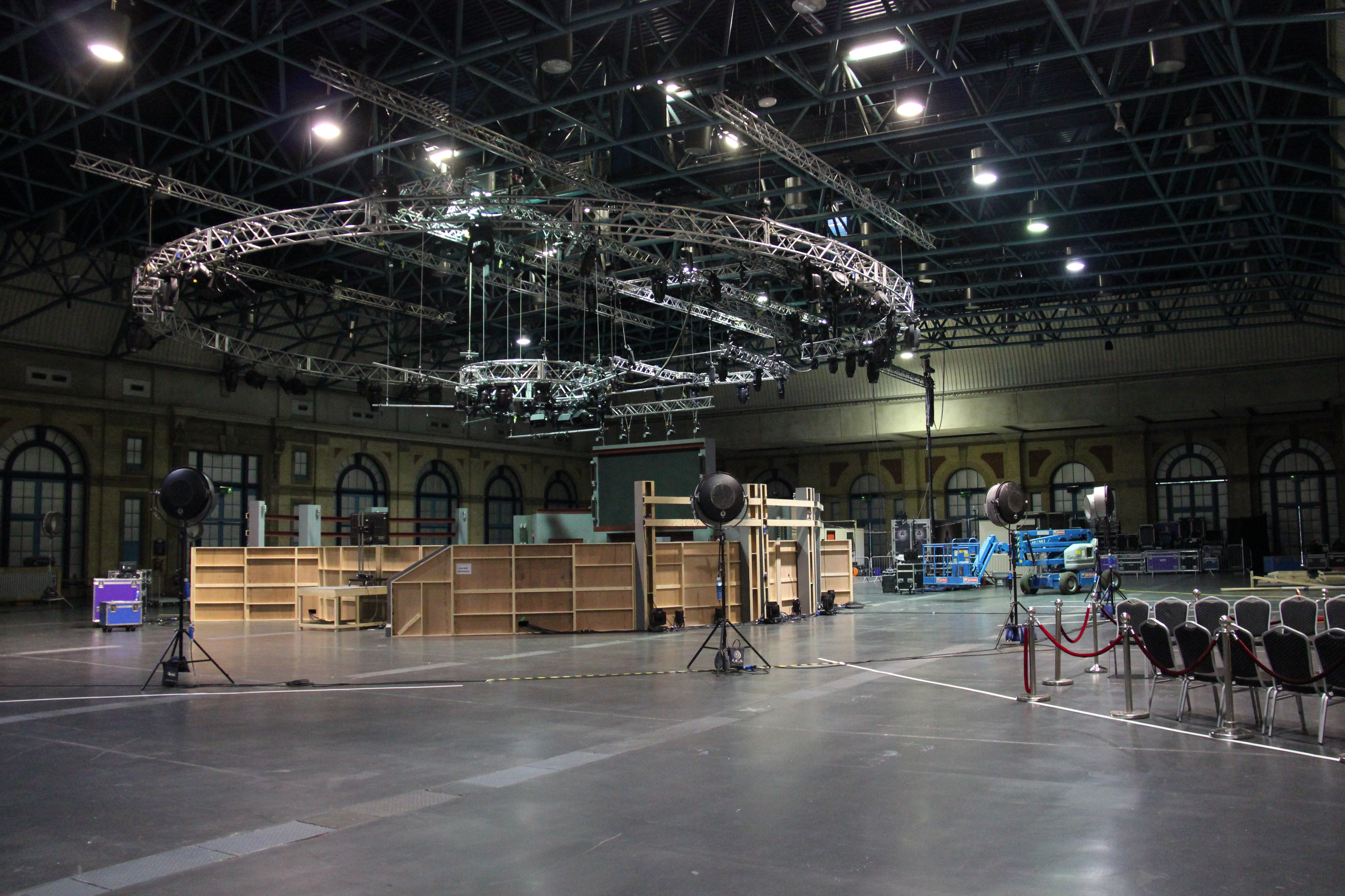 West Hall at Alexandra Palace, spacious event venue with overhead truss for gatherings.