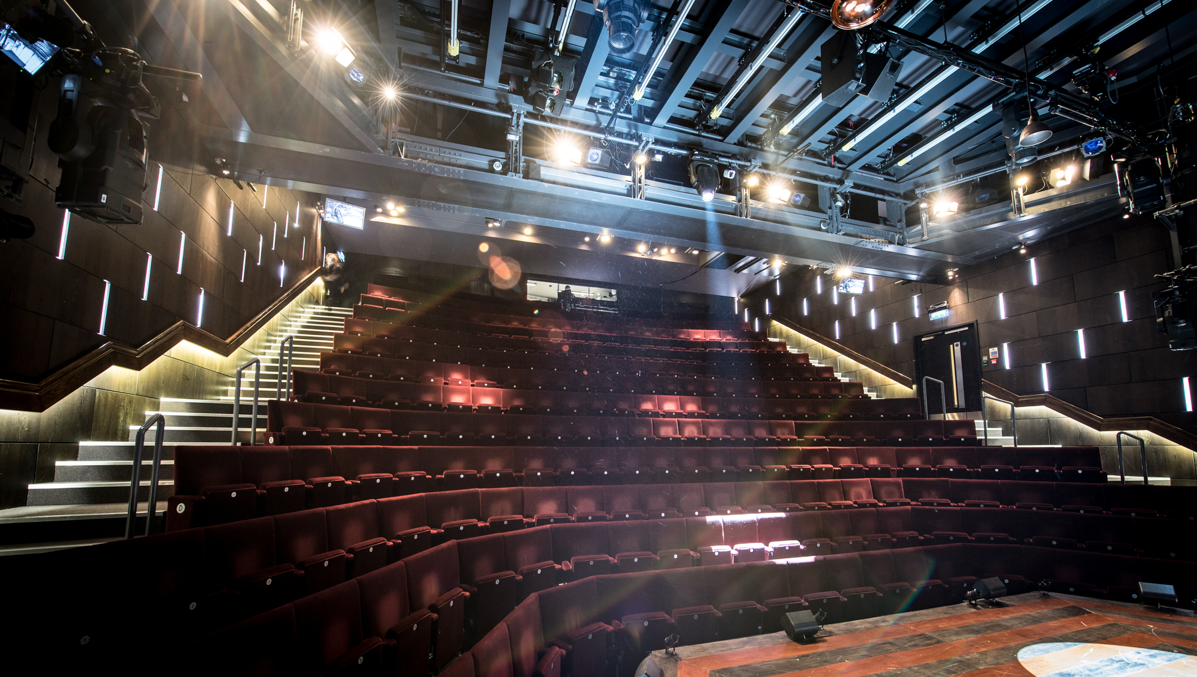 Modern theater with tiered seating, ideal for events and presentations.