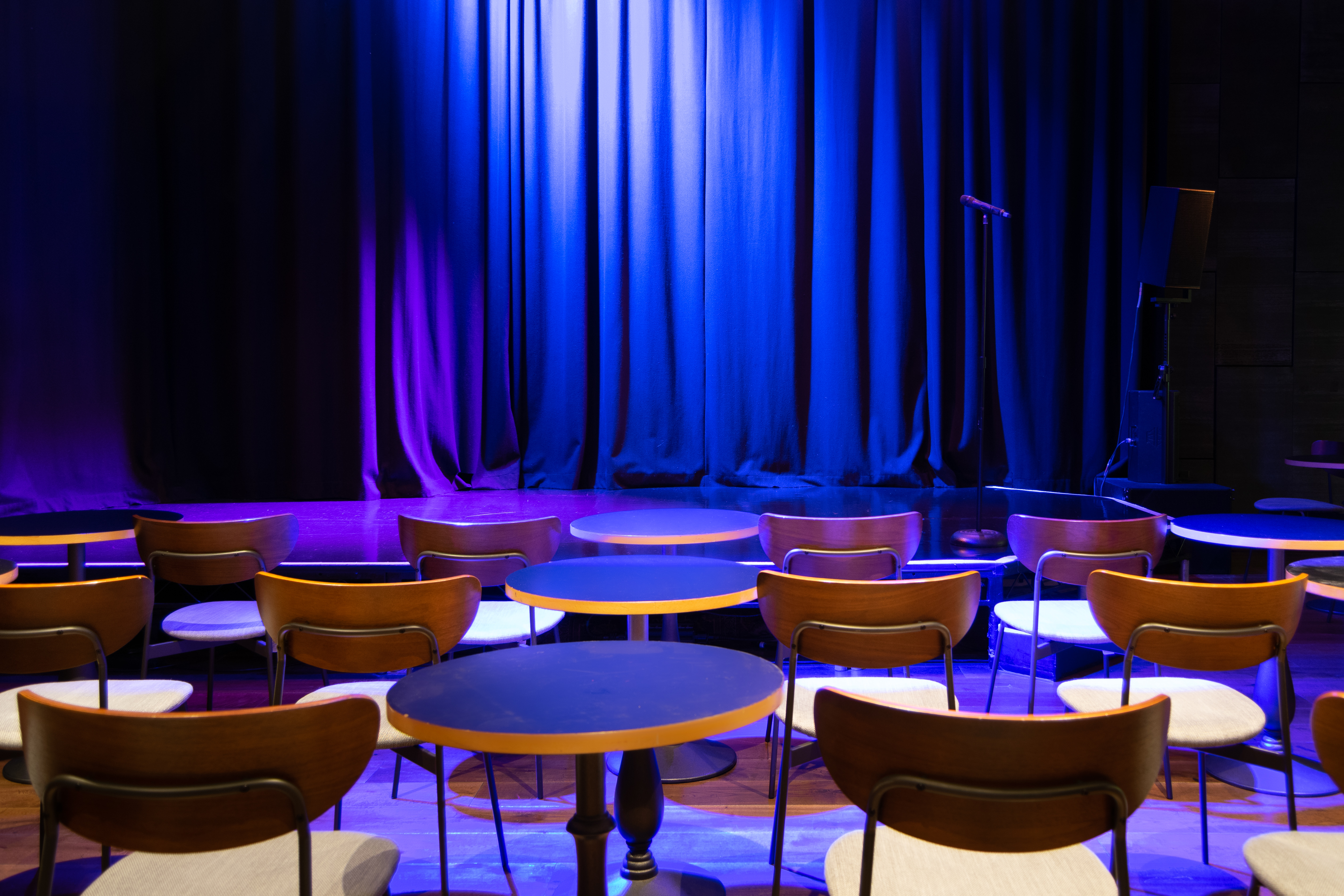 Intimate event space with stage and dramatic lighting at The Other Palace Theatre.