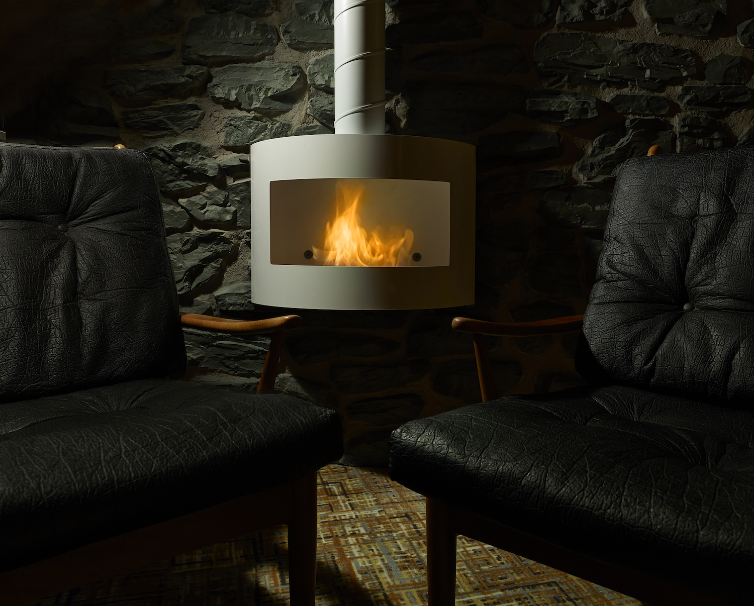 Cozy venue with modern fireplace for small group meetings and retreats in Keystone Crescent.