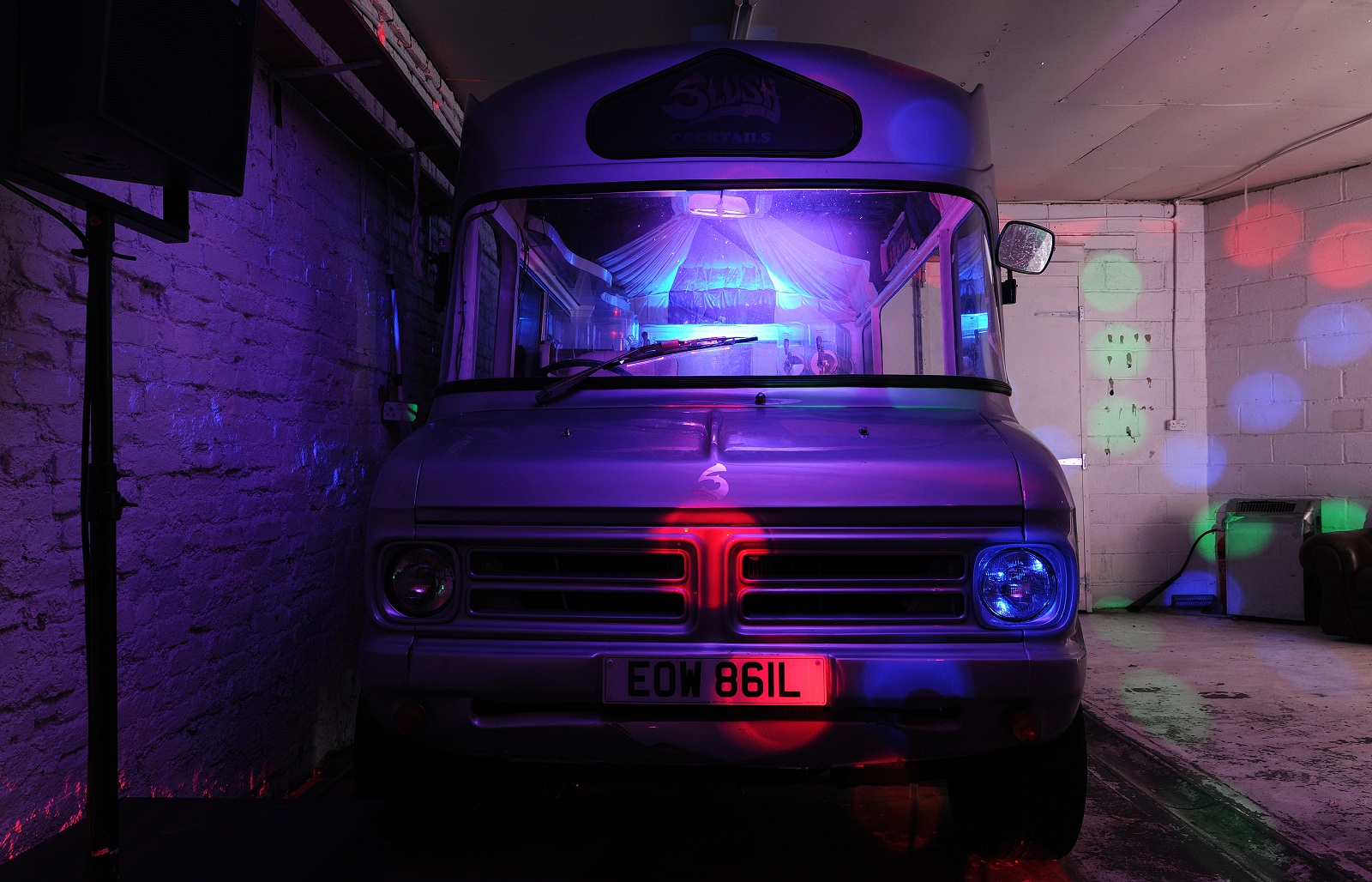 Vintage food truck in vibrant venue, perfect for unique event catering and gatherings.