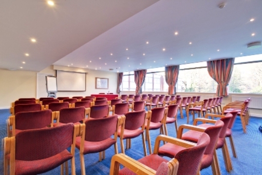 Calthorpe Suite meeting room with natural light, perfect for seminars and presentations.