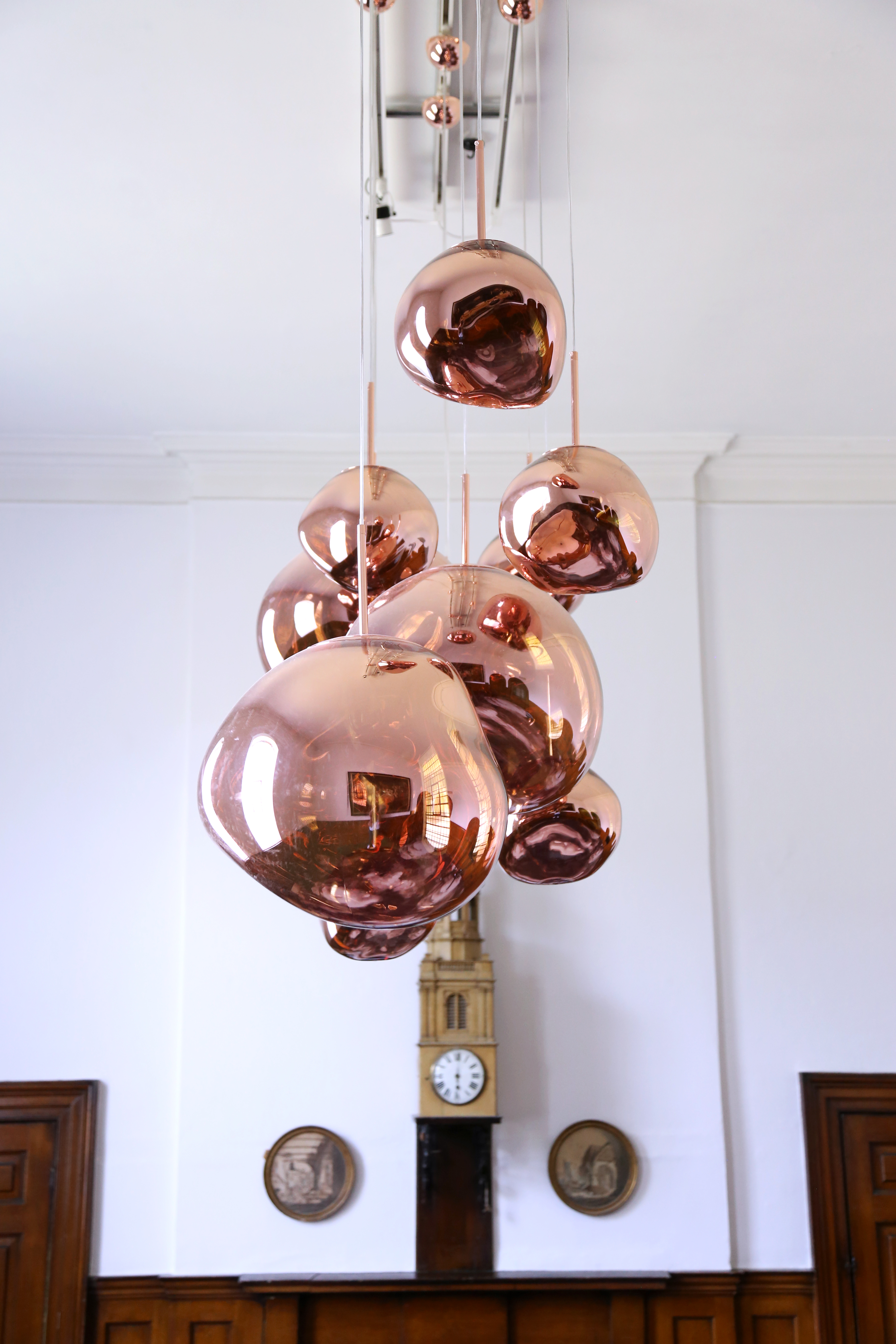 Reflective copper pendant lights in The Vestry, ideal for upscale events and gatherings.