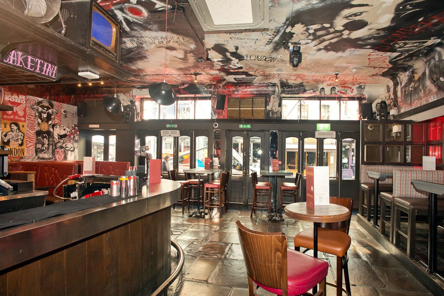 Vibrant Bar Soho venue with artistic ceiling, perfect for networking events and gatherings.