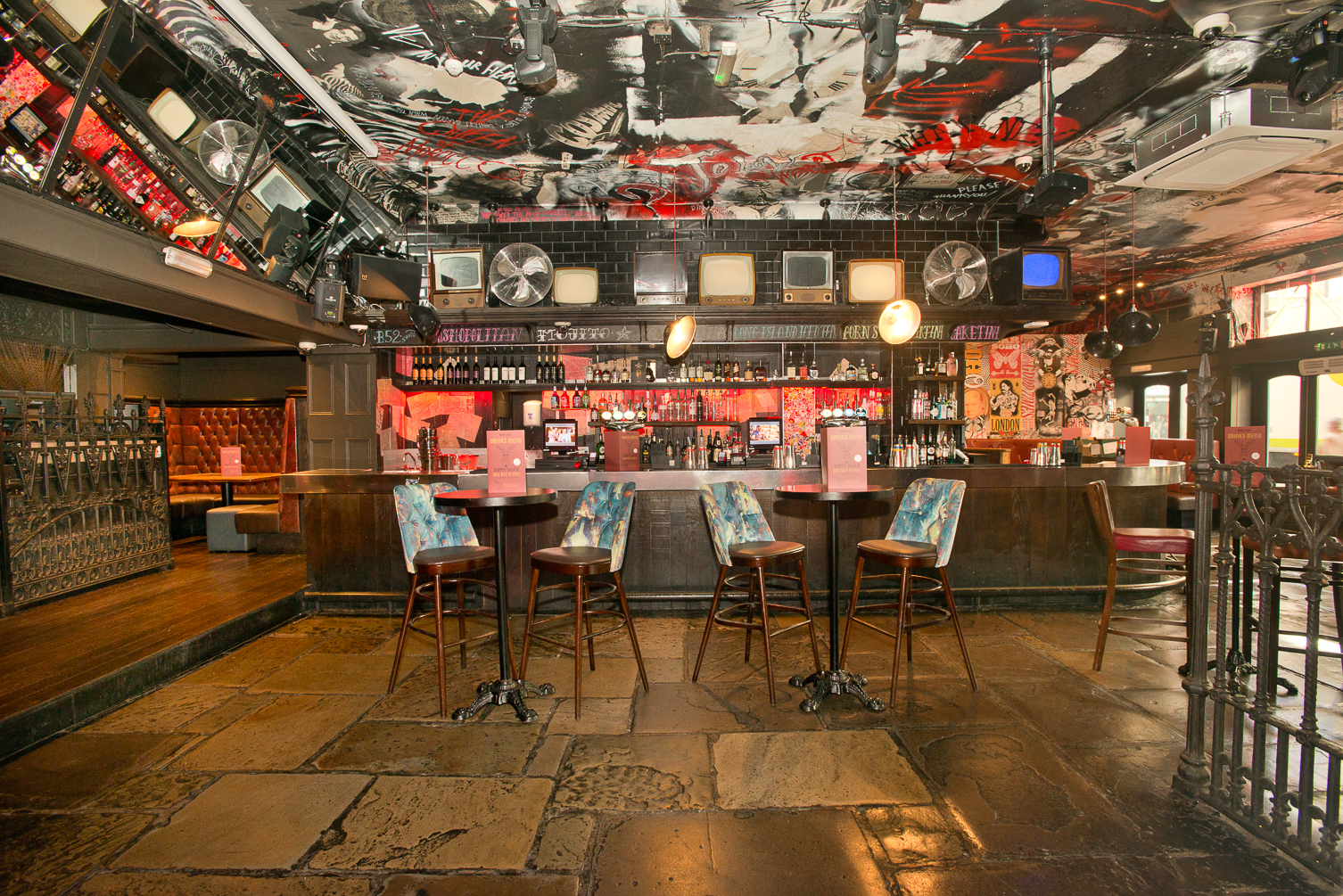 Vibrant Bar Soho venue with artistic ceiling, perfect for creative events and gatherings.