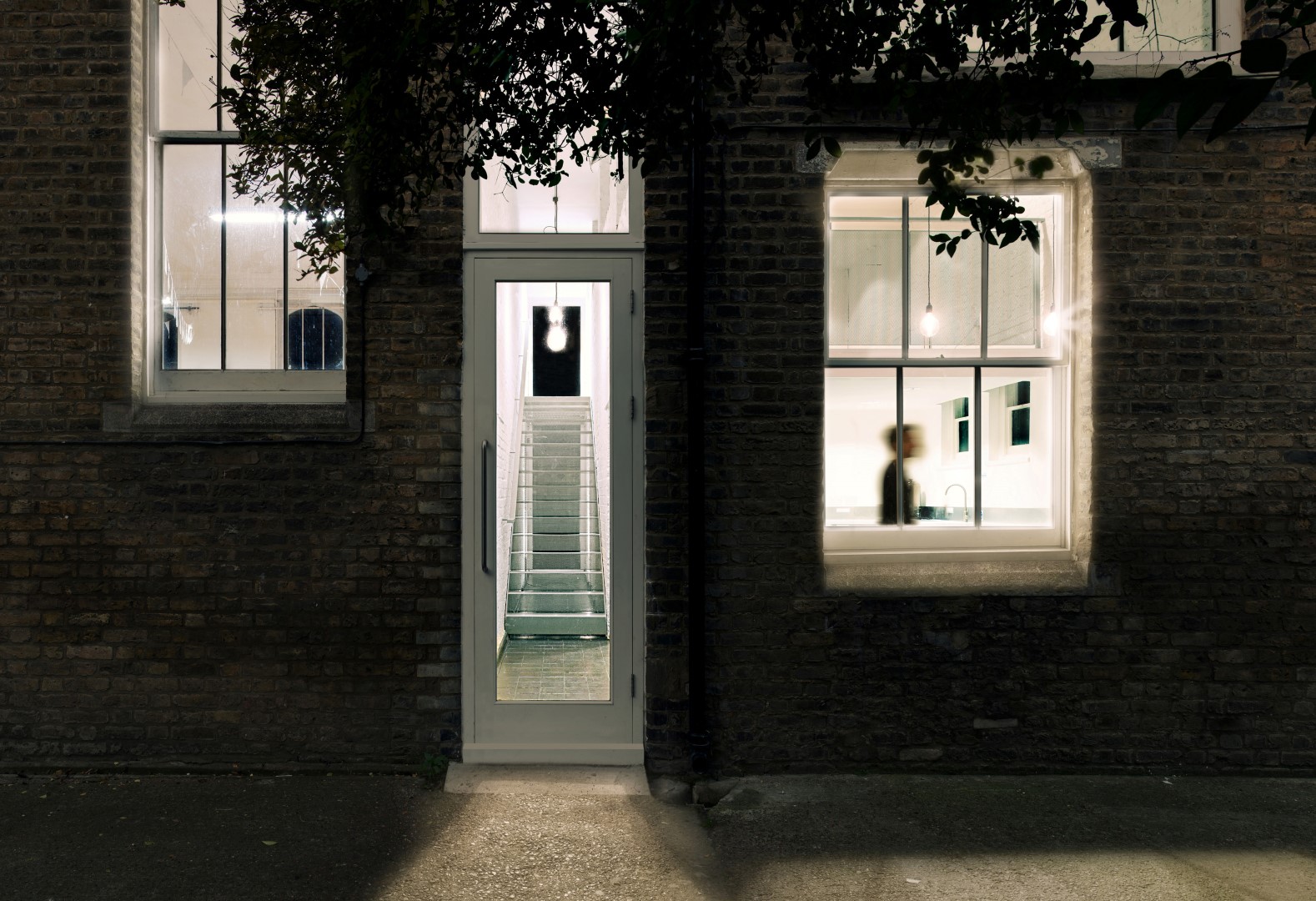 Modern venue entrance with sleek door and large windows for events in Dalston.