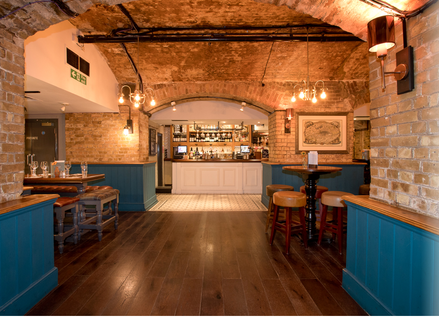 Stylish venue with exposed brick arches for intimate gatherings and networking events.