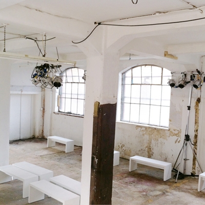 Versatile industrial event space with large windows for creative workshops in Maple Works.