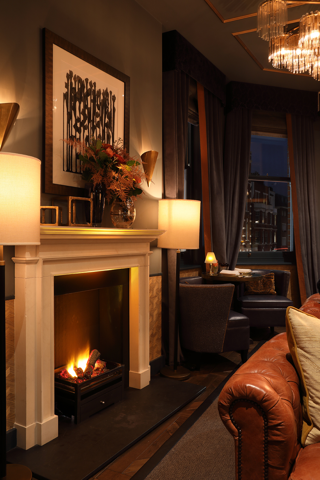 Sophisticated lounge with fireplace at Albert's Club Room for networking events.