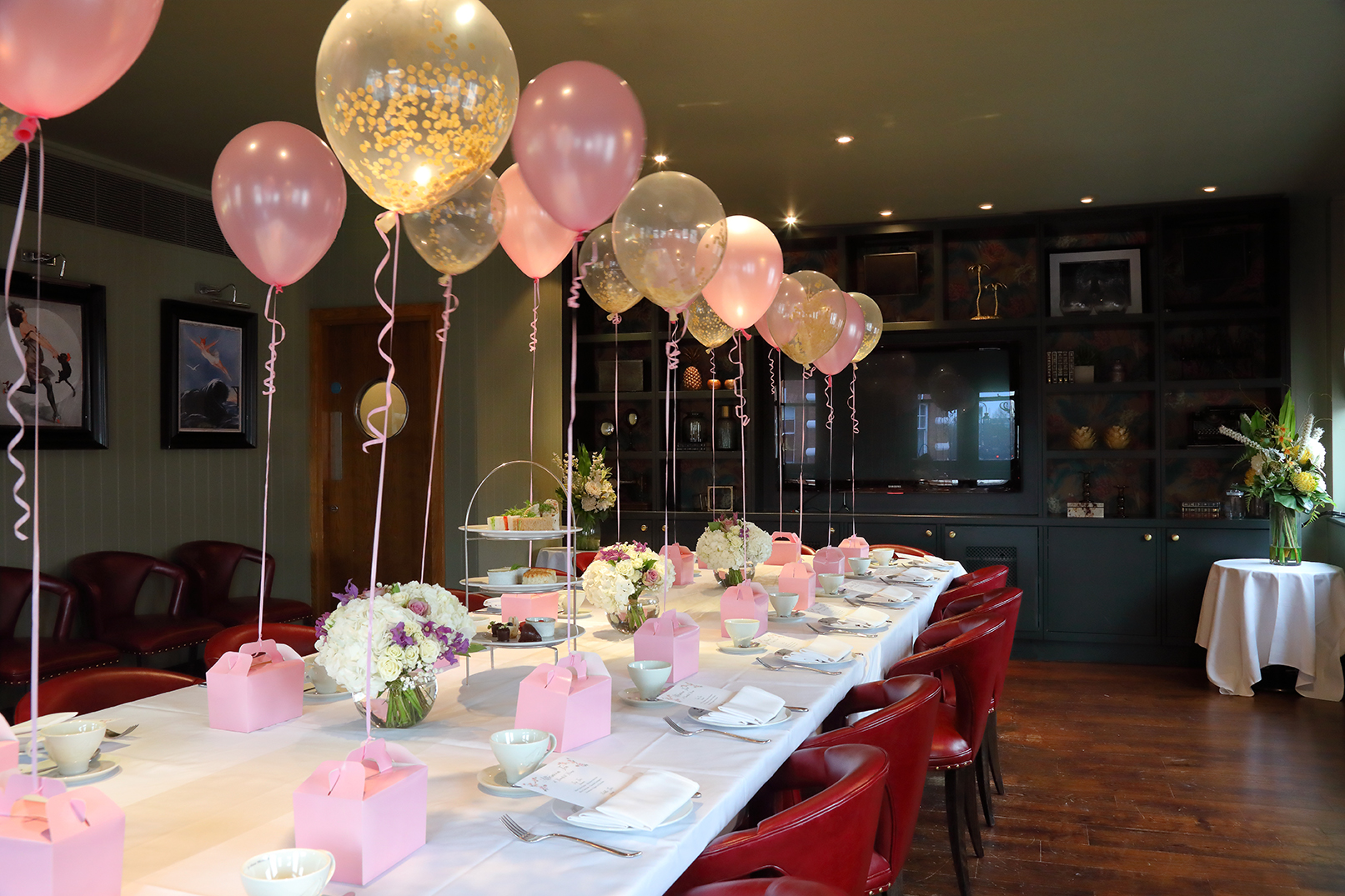 Private dining room with pastel decor, ideal for celebrations and intimate gatherings.