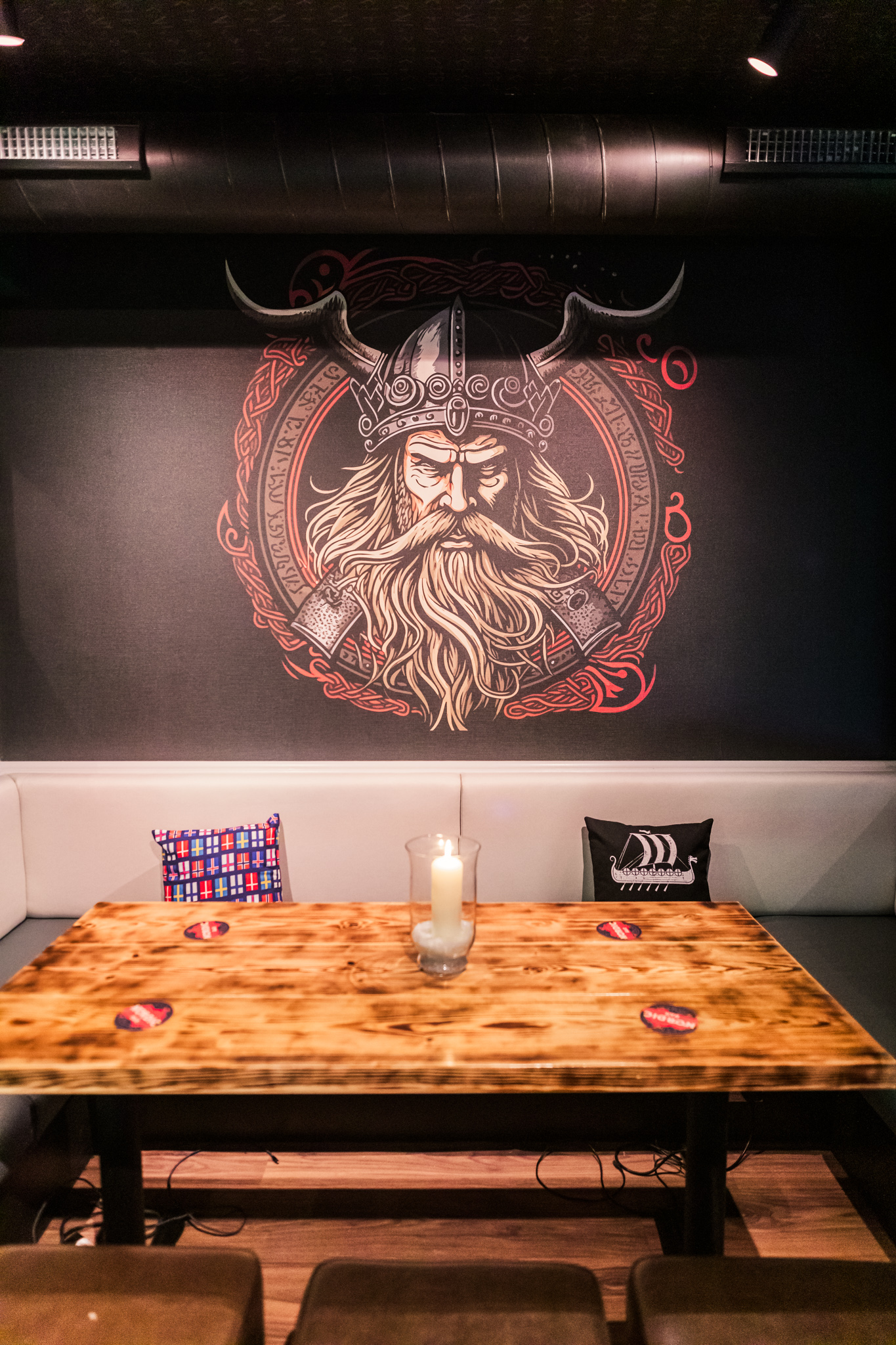 Nordic Bar meeting space with king mural, ideal for creative events and gatherings.