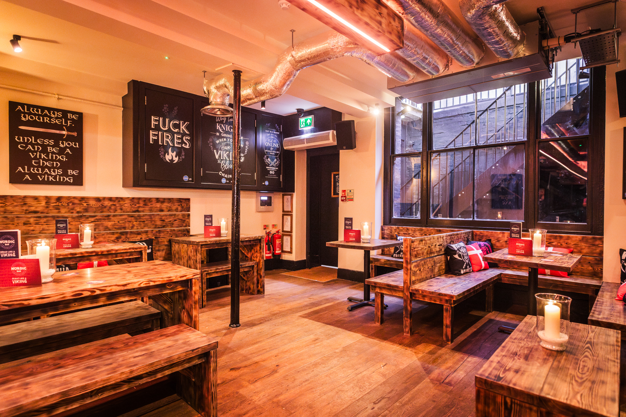 Cozy rustic venue with wooden tables, ideal for networking and team-building events.