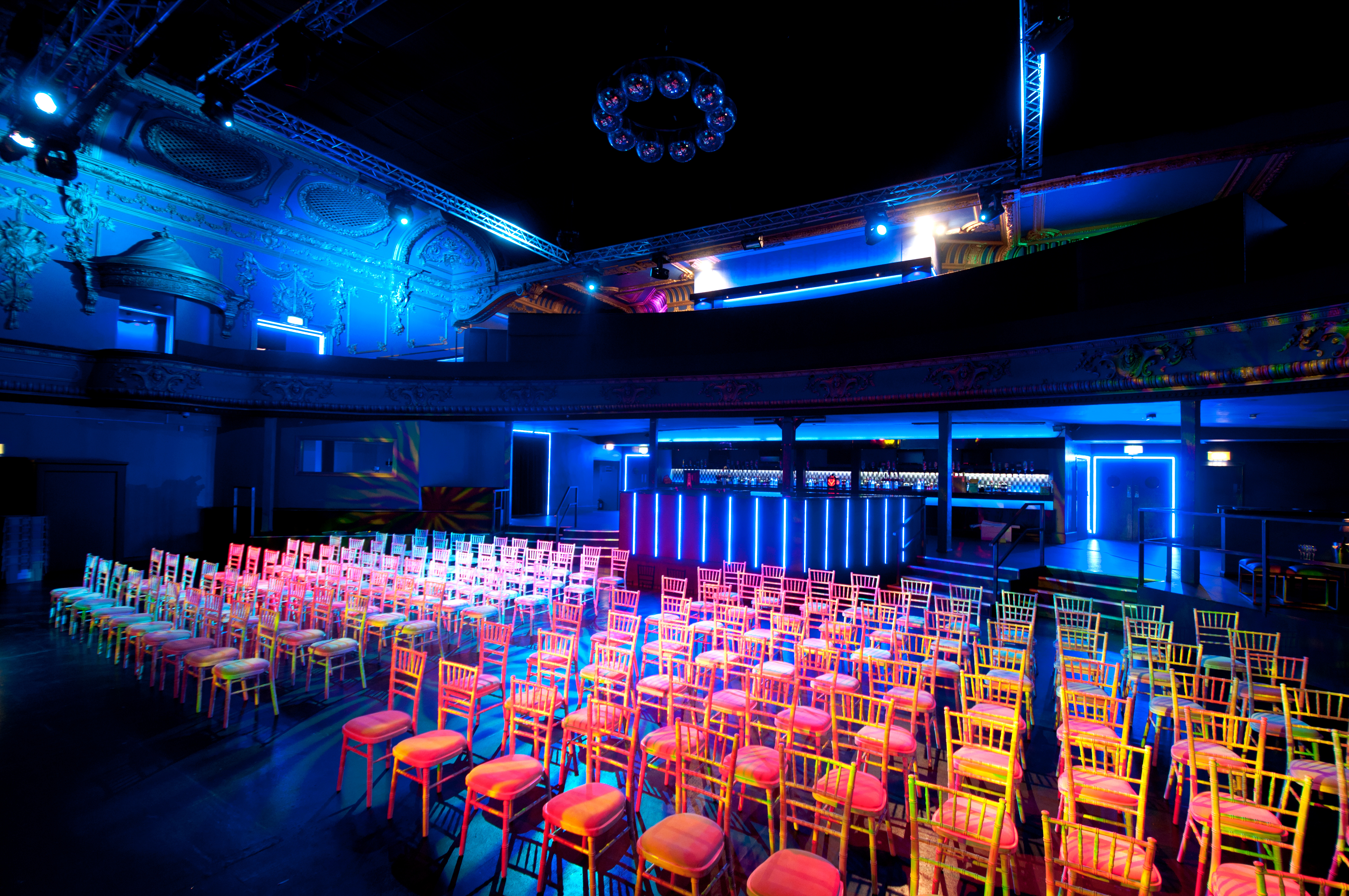 Electric Brixton event space with colorful chairs, ideal for meetings and presentations.