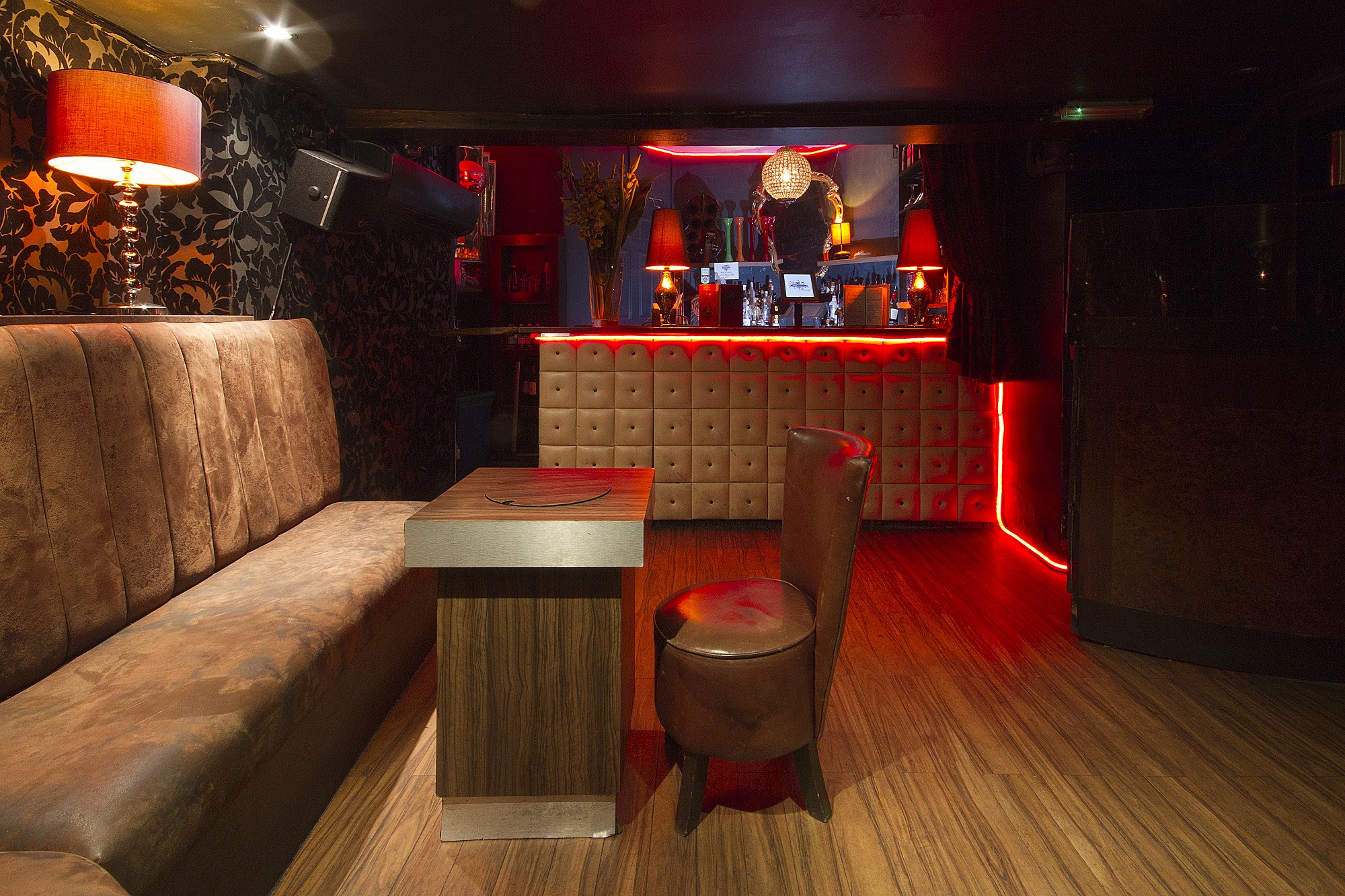 Stylish intimate venue with warm lighting for private events and networking gatherings.