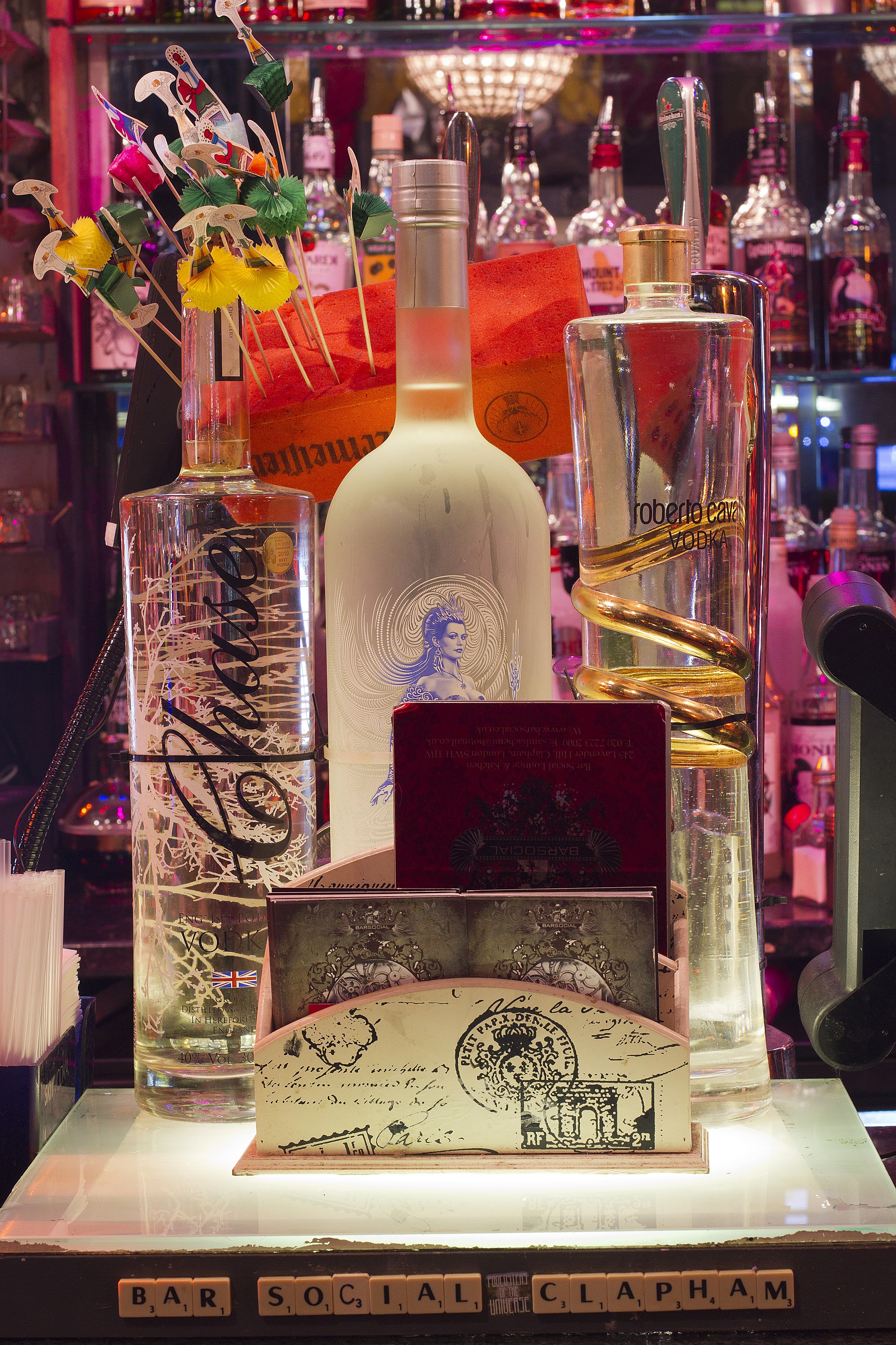 Vibrant premium spirits display at Bar Social for upscale networking events.