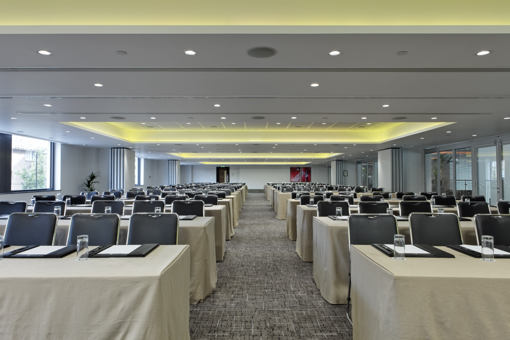 Conference room at Leonardo Royal Hotel London, set for professional event with natural light.