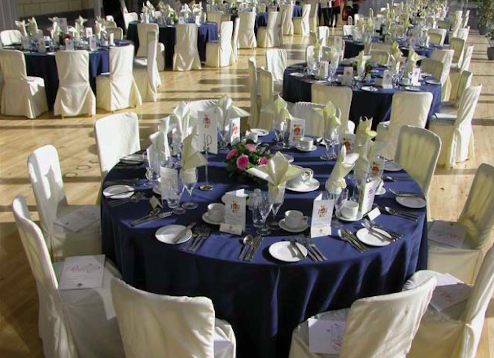 Elegant banquet hall at RAF Museum with navy blue linens for weddings and corporate events.