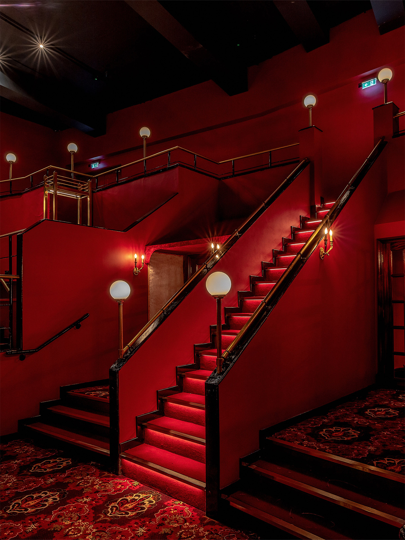 KOKO venue with bold red walls and elegant lighting for upscale events.