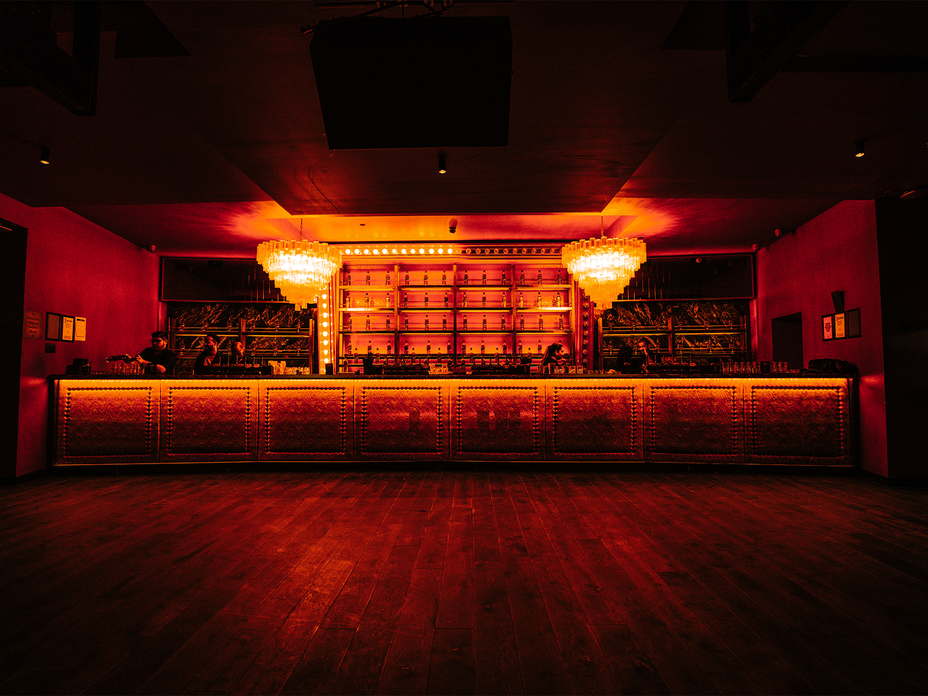 Stylish KOKO venue bar with red walls, ideal for cocktail receptions and networking events.