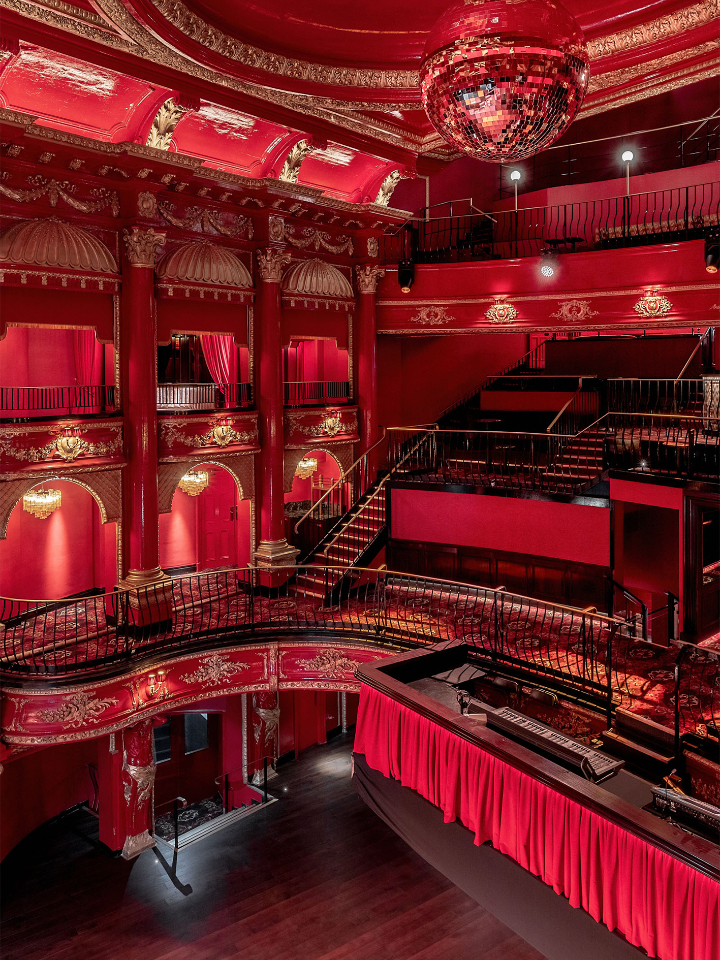 Luxurious KOKO venue with red decor, ideal for gala events and meetings.