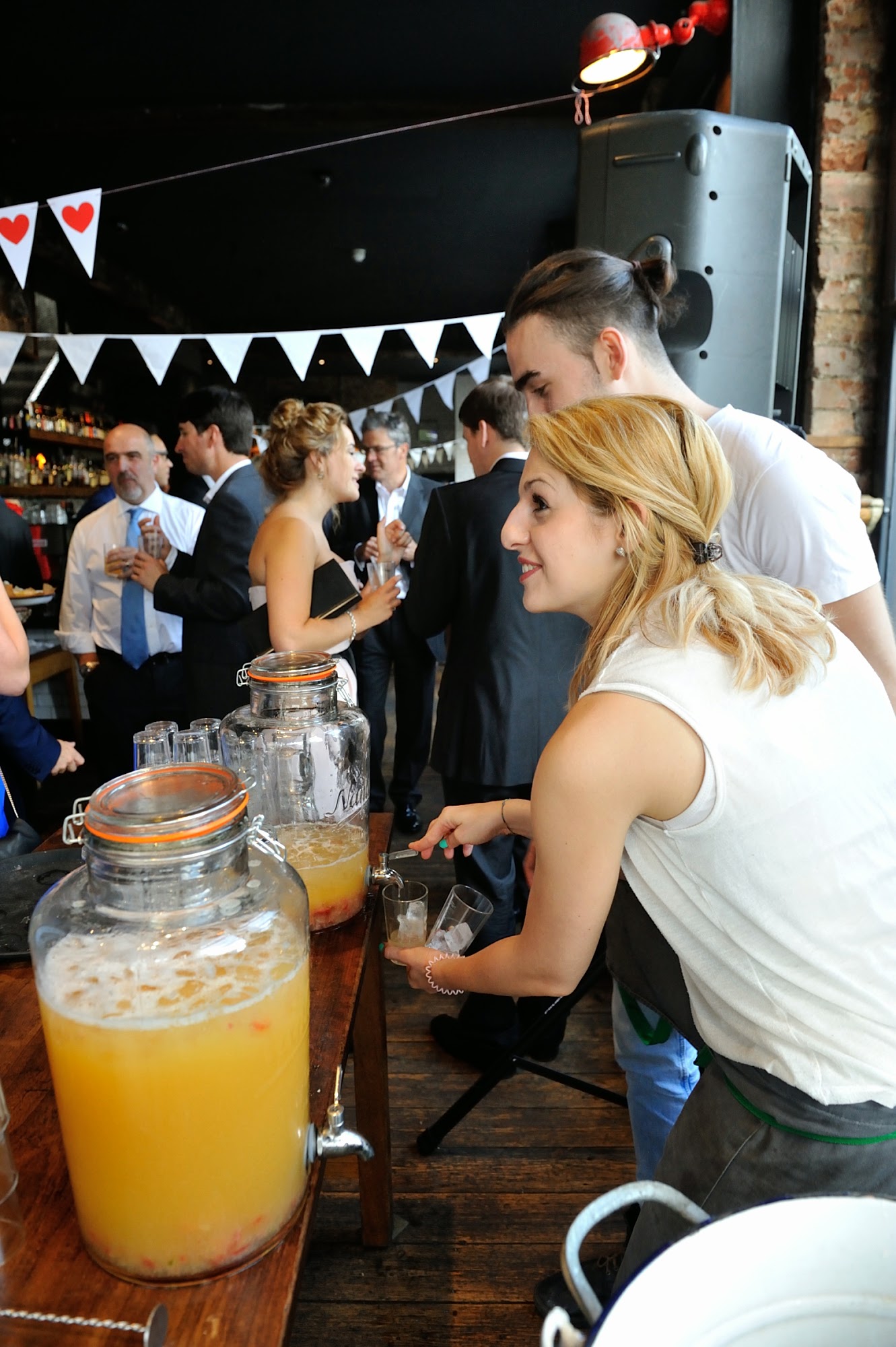 Vibrant networking event at Top Bar, stylish venue with engaged attendees and themed decor.