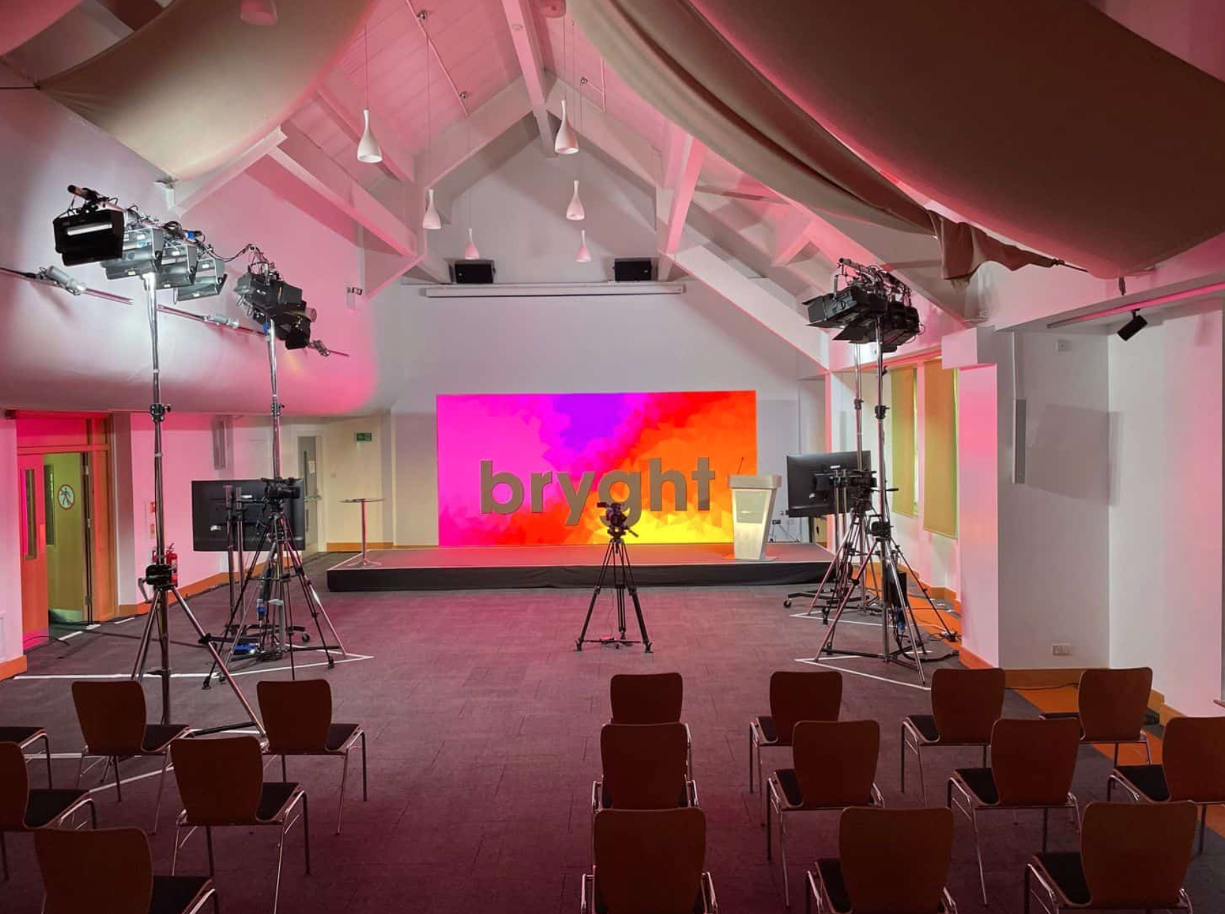 Hybrid event space in Birmingham with professional lighting and audio-visual setups.