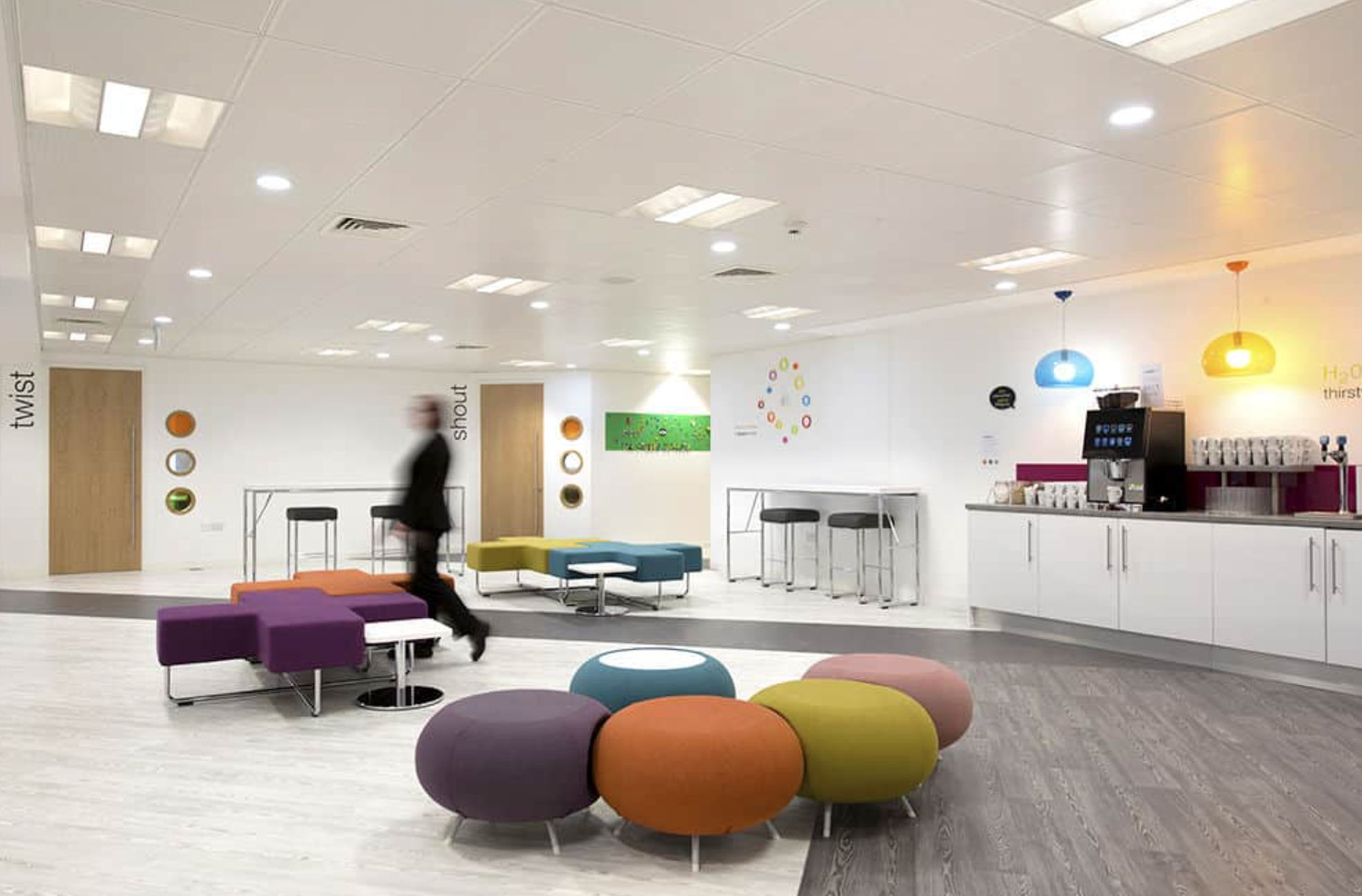 Modern meeting space in Birmingham with colorful seating for creative events.